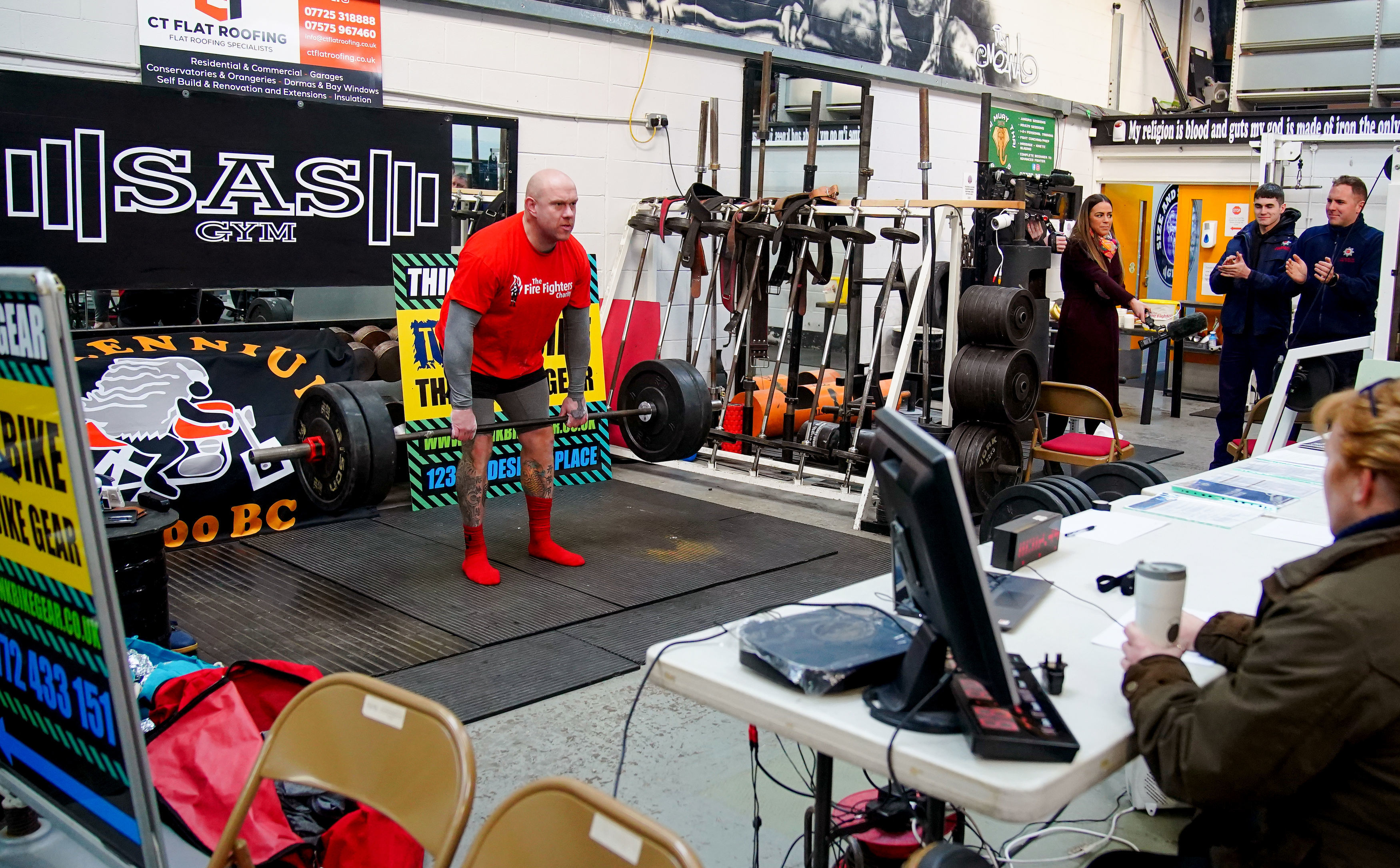 Firefighter Glen Bailey, 42, attempts to break the Guinness World Record for the most weight lifted in 24 hours at the SAS gym in Leyland, Lancashire, to raise money for the The Fire Fighters Charity. (Peter Byrne/PA)