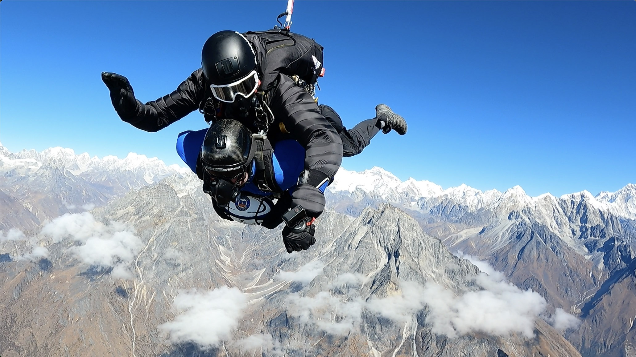 Man in tandem skydive through the Himalayas