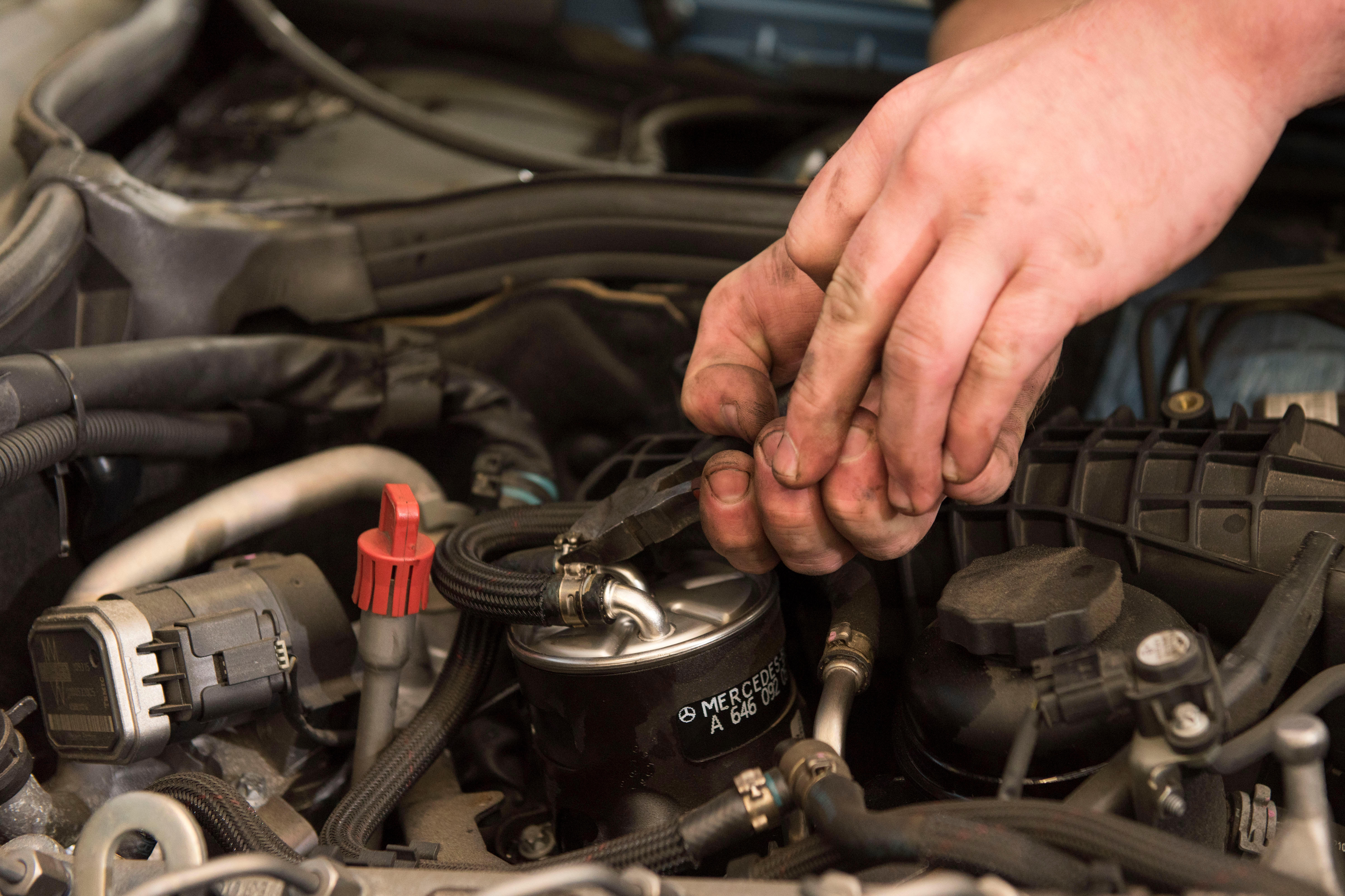 A mechanic working on a car