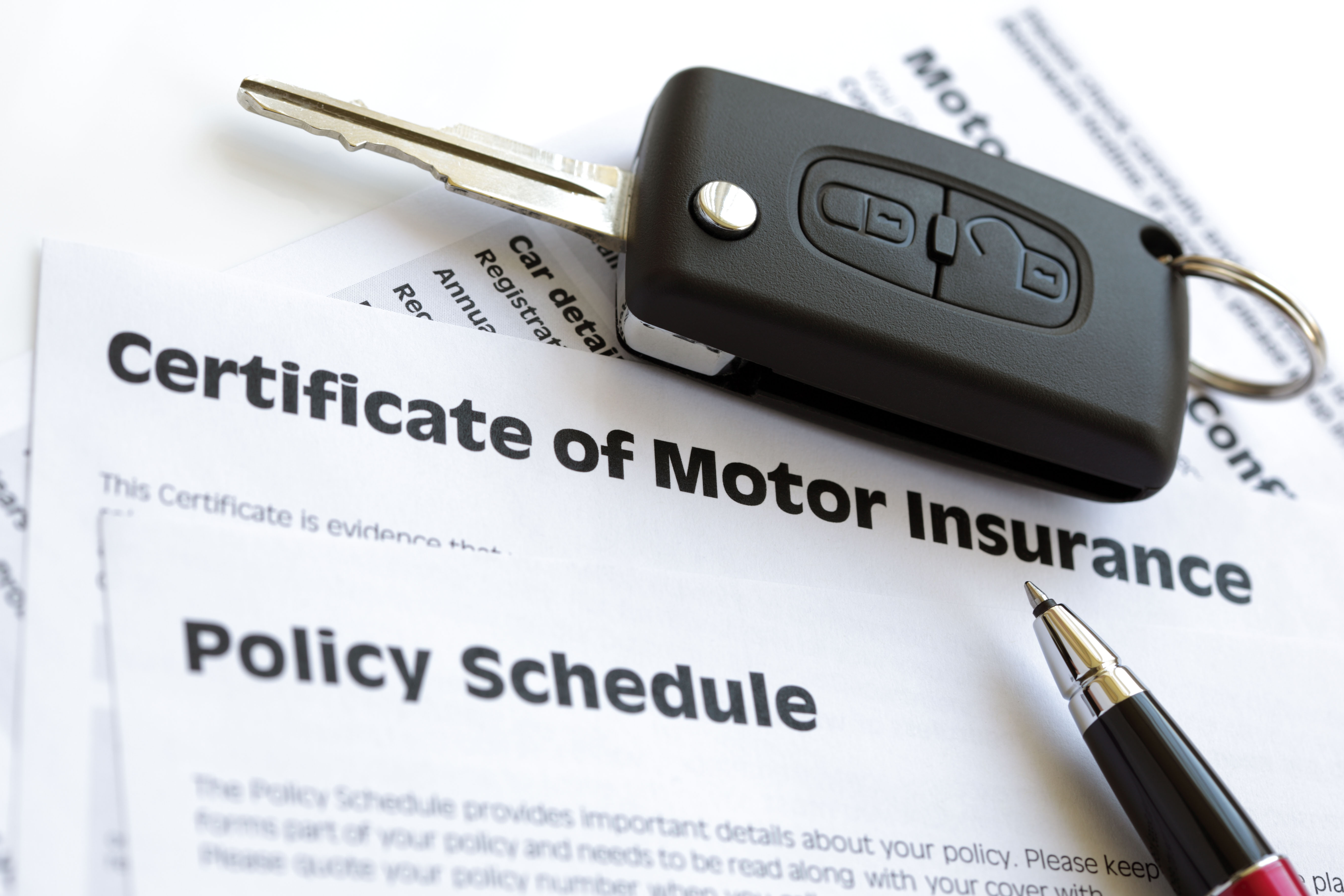 Motor insurance certificate with car key
