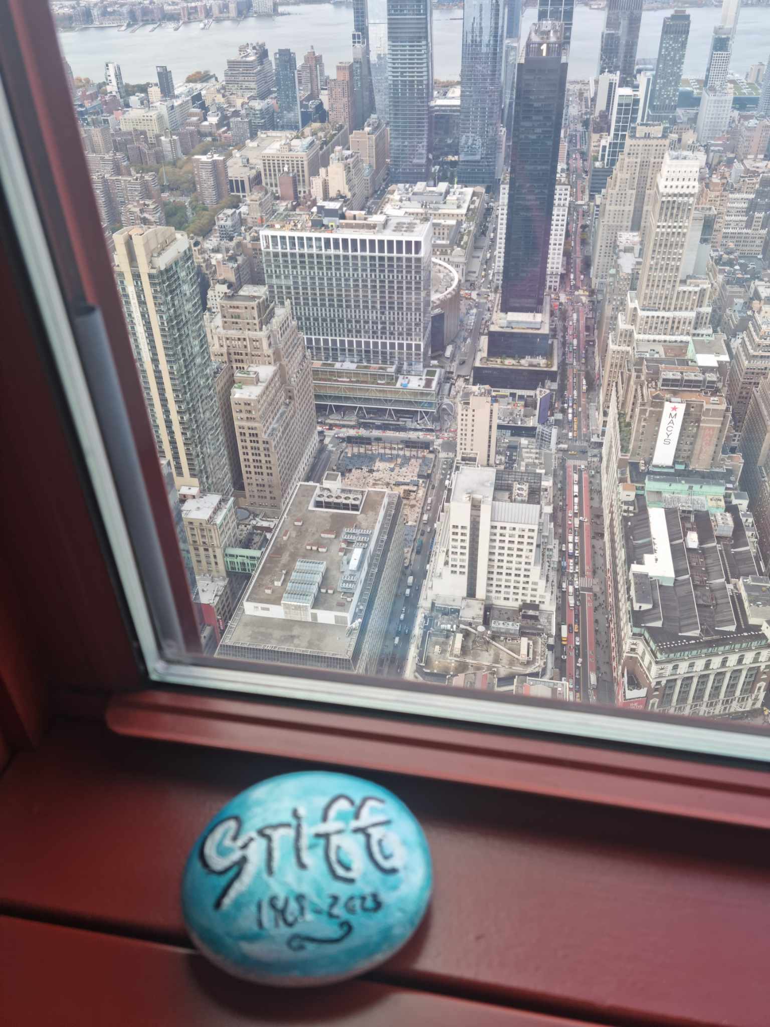 A blue rock reading the word 'Griff' on the 86th floor of the Empire State Building in New York City