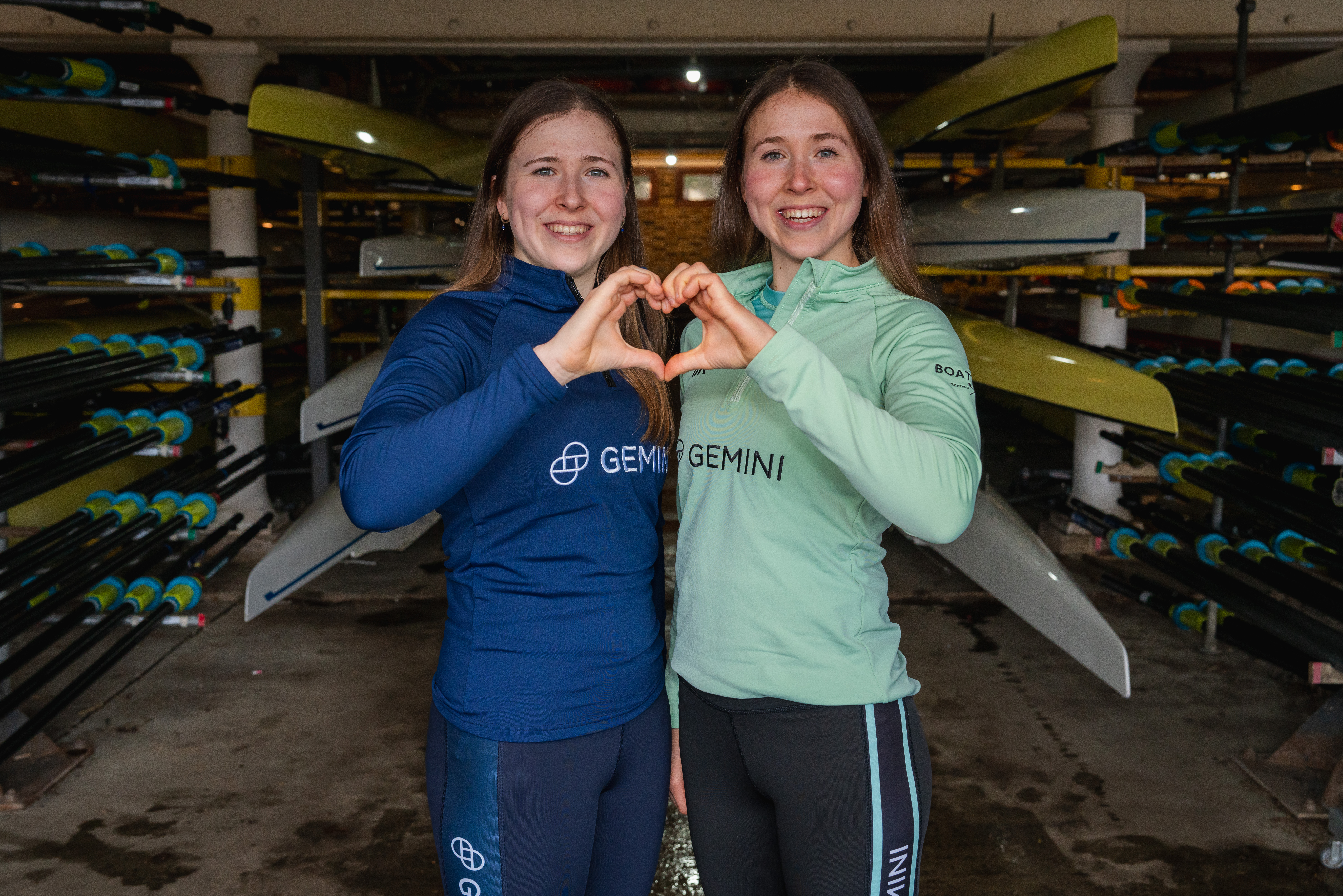 A photo of Catherine and Gemma King making a heart with their hands