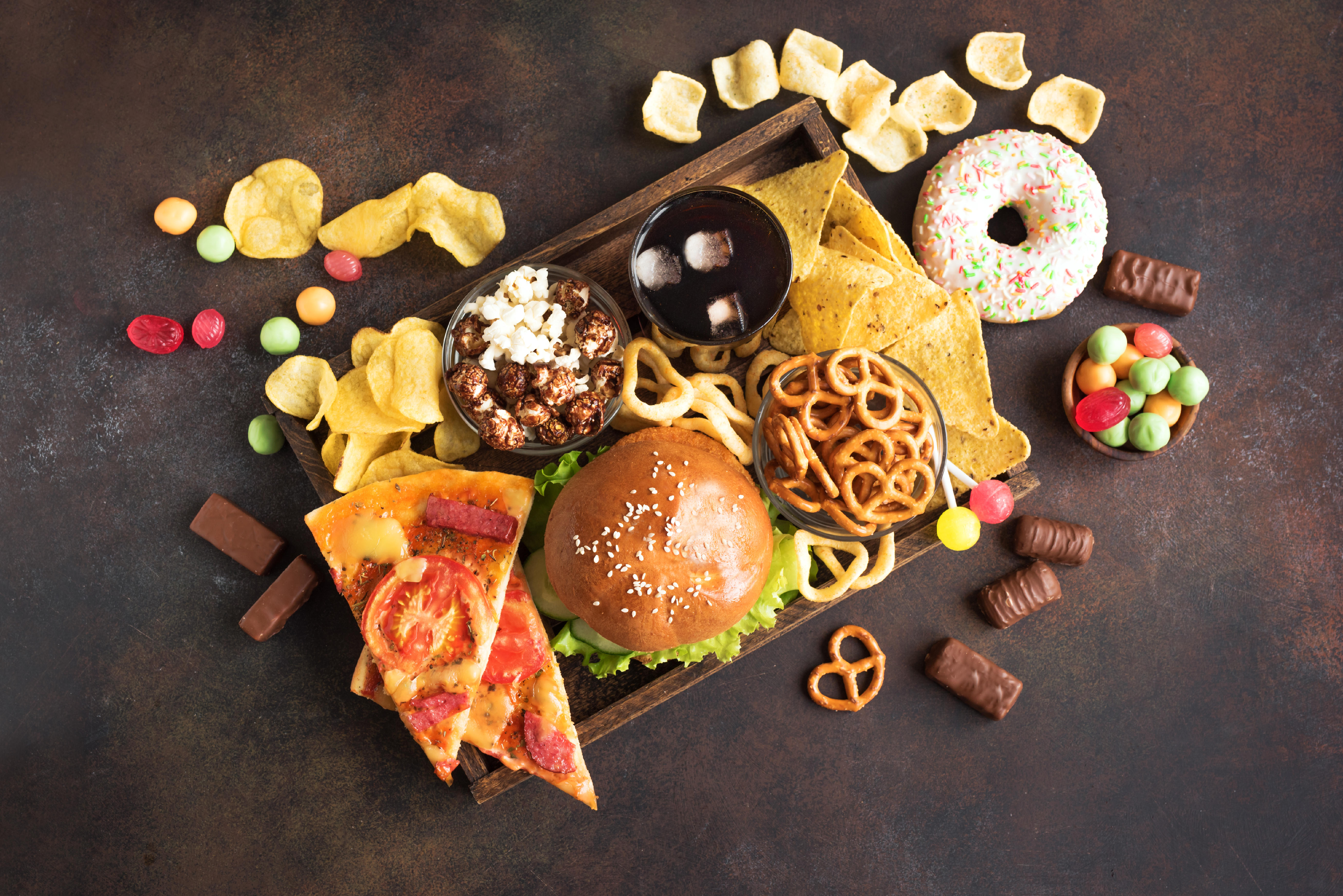 2A5EFD7 Assortment of Unhealthy Food, top view, copy space. Unhealthy eating, junk food concept.