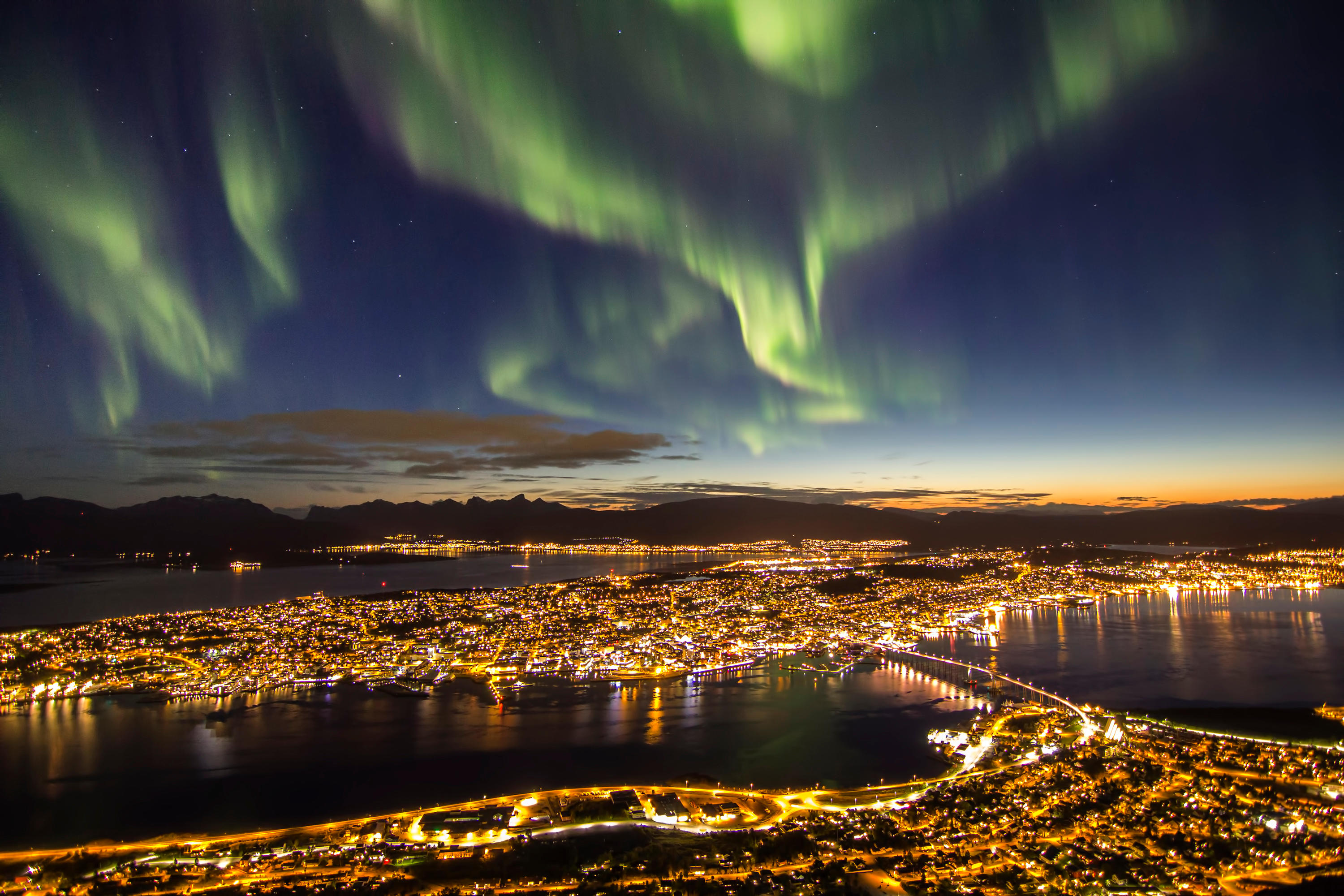 Northern lights above Tromso in Norway (Alamy/PA)