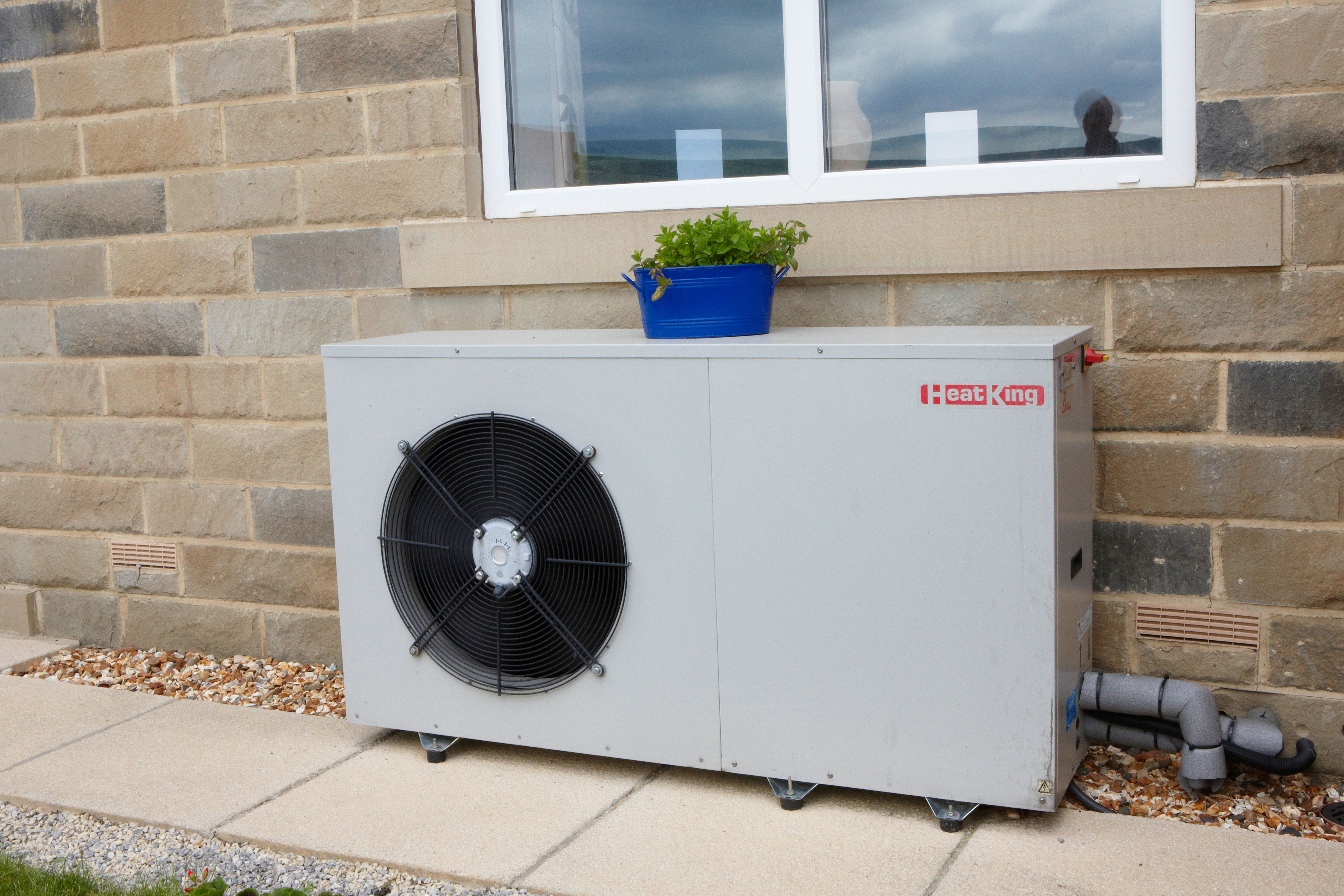 An air source heat pump outside a hous