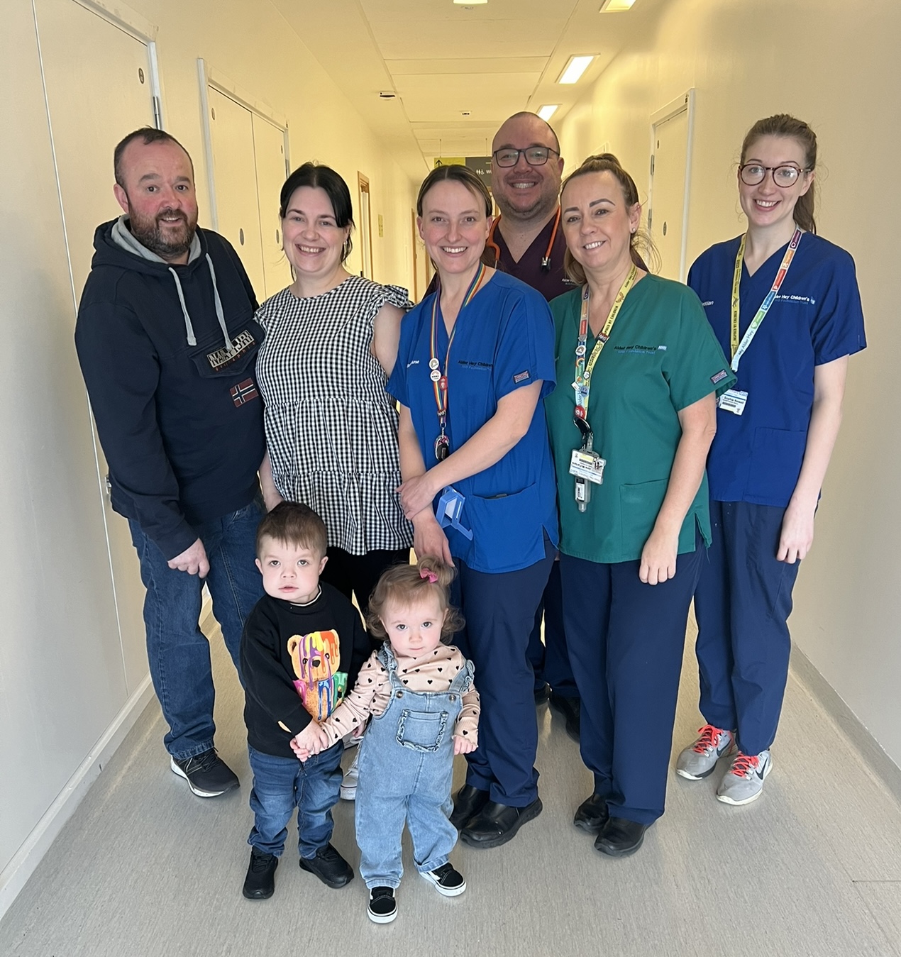Shaemus Flood, 7, with his family and some of the renal team at Alder Hey Children's Hospital