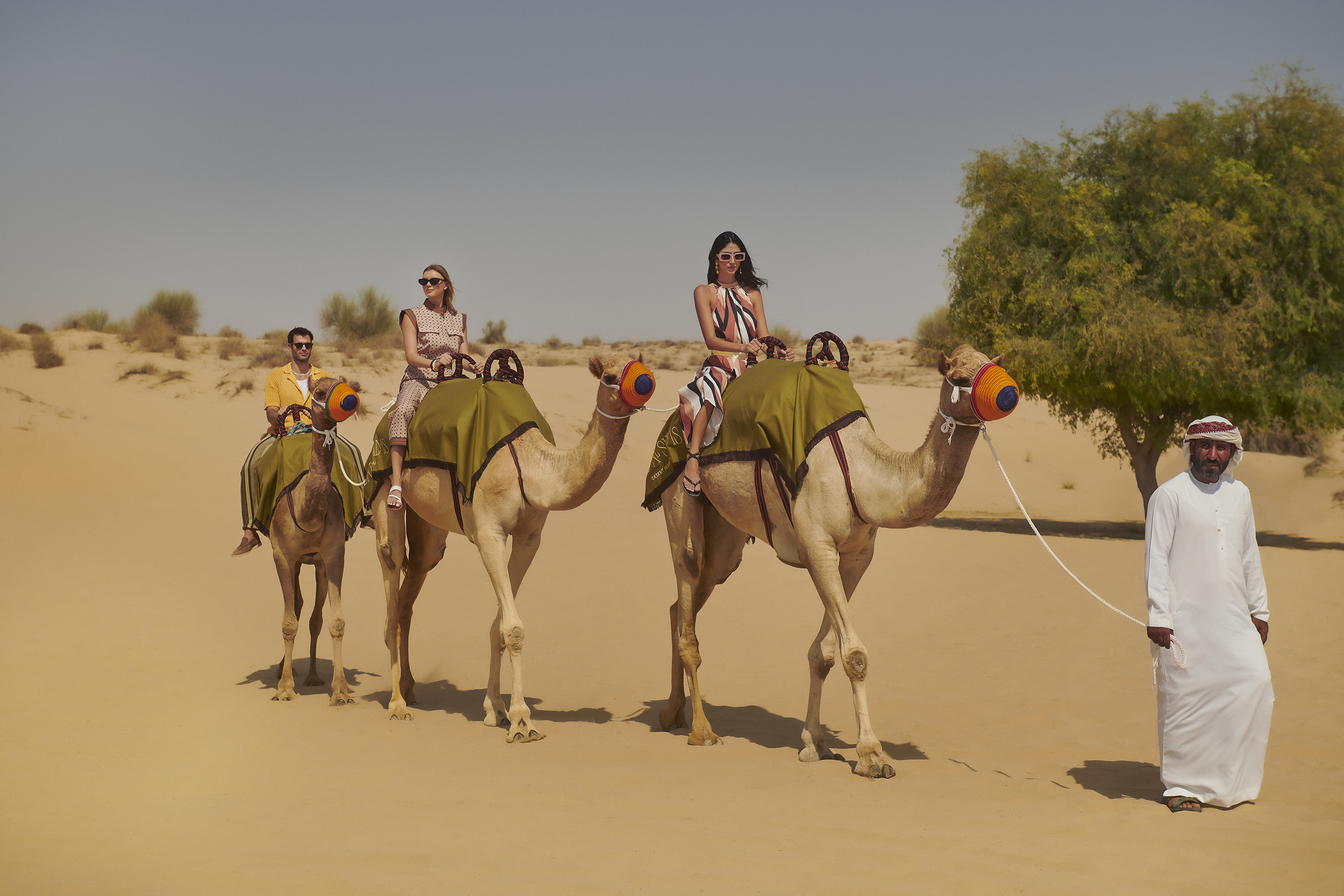 Camel riding in the desert (Bab Al Shams/PA)