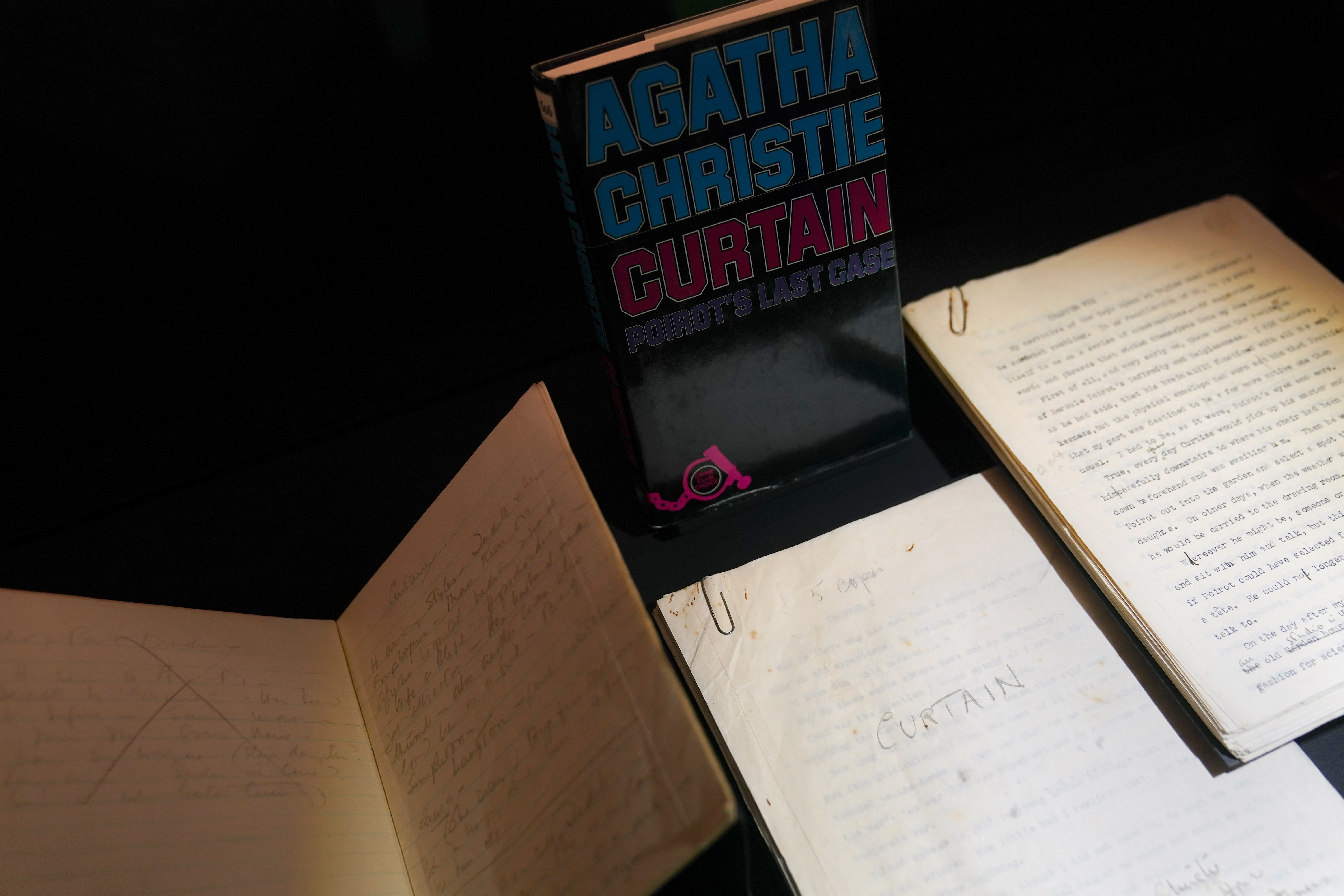 Agatha Christie's notebook and typescript for Curtain: Poirot's Last Case, which was kept in a bank vault for decades to avoid news of the detective's death from leaking, on display during a preview of Murder by the Book: A Celebration of 20th Century Crime Fiction. (Joe Giddens/ PA)