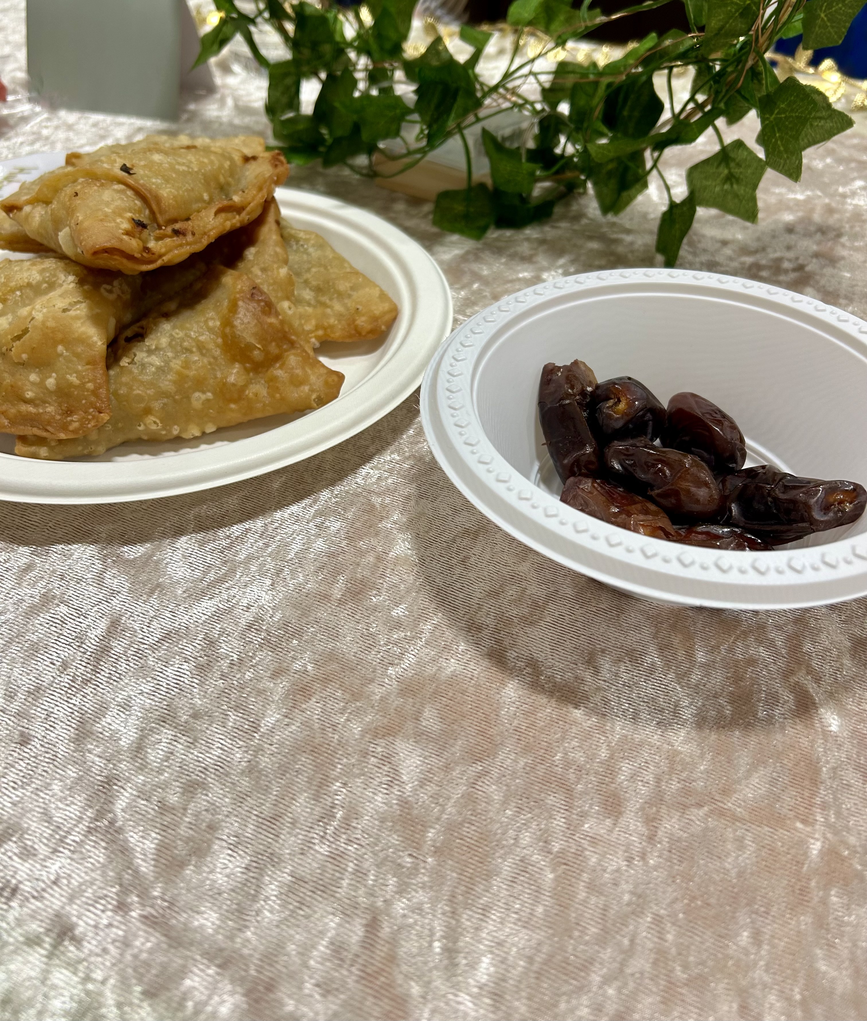 A plate of dates and samosas 