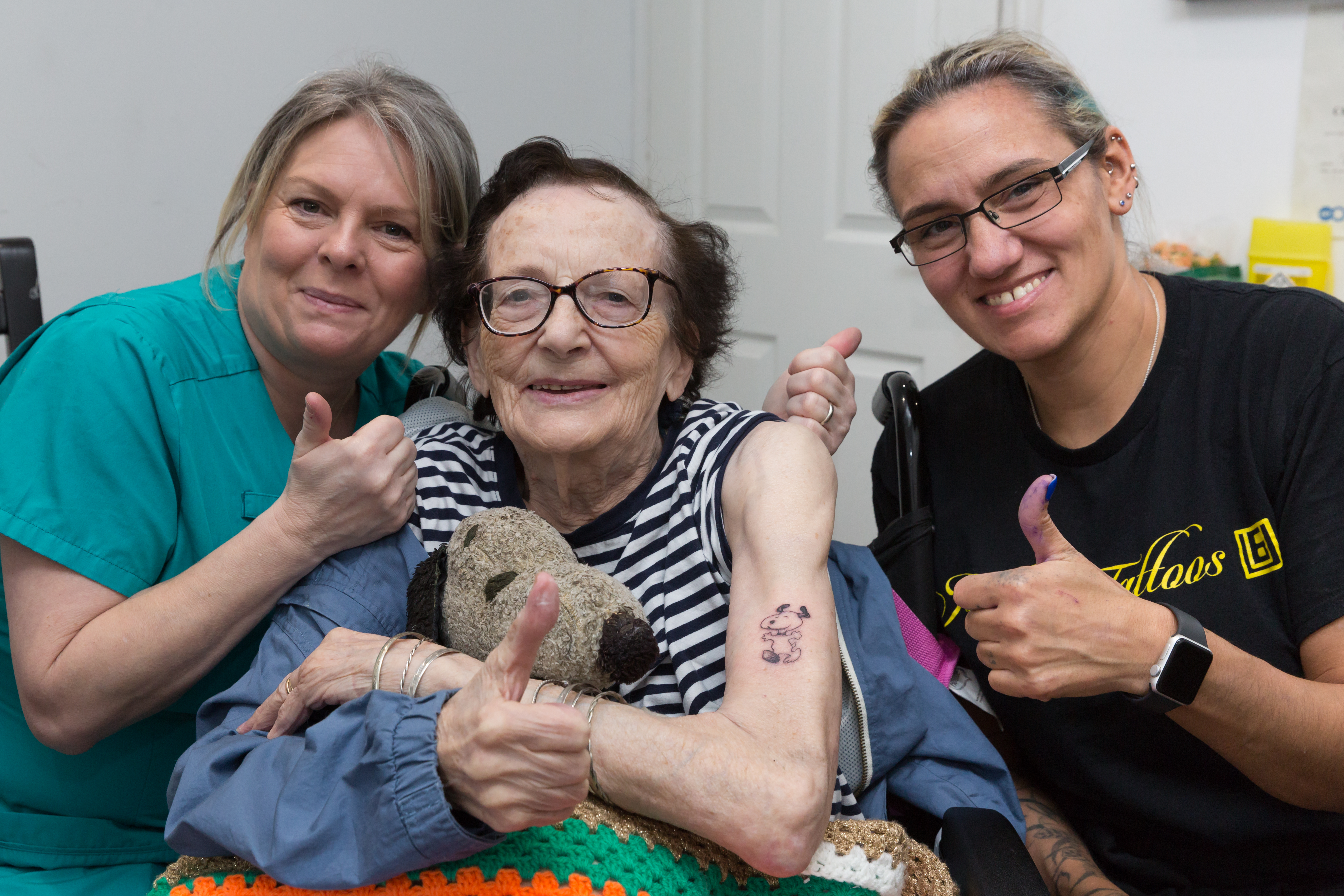 Care home resident after getting her first tattoo
