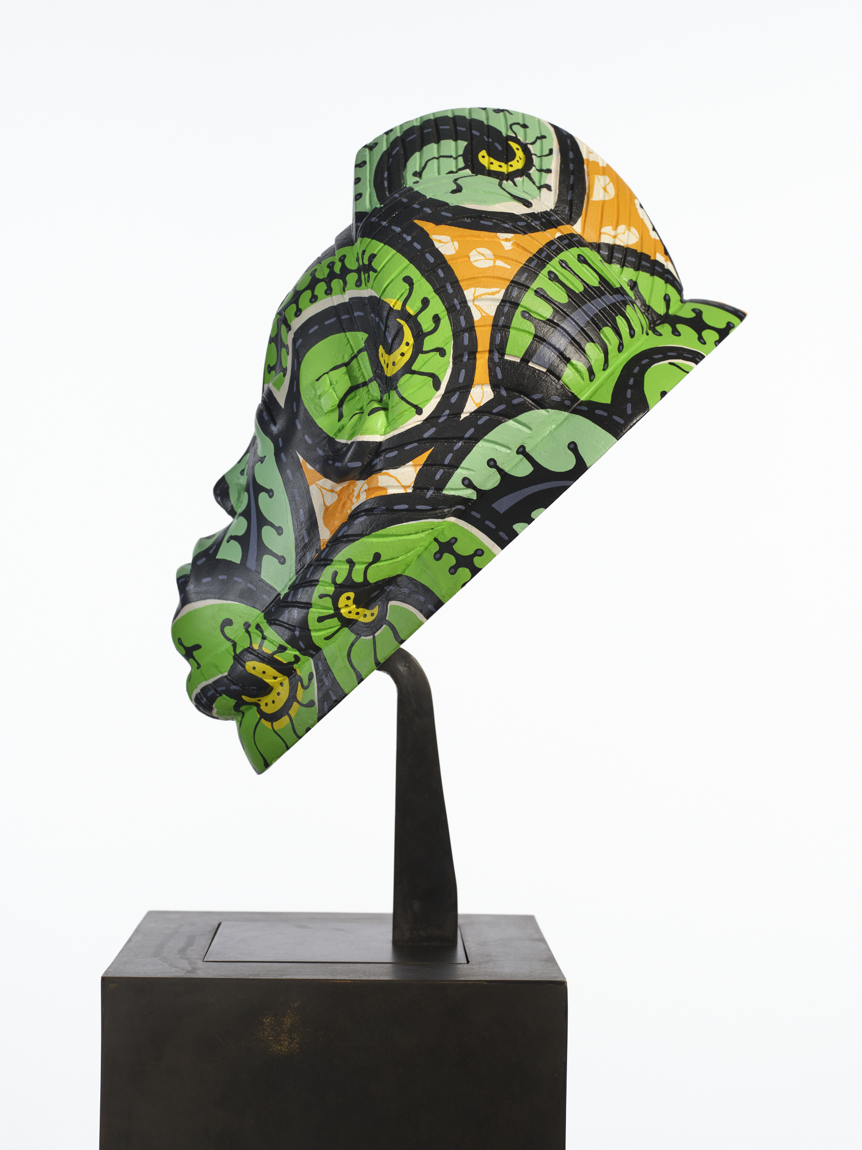 A wooden mask by Yinka Shonibare CBE is one of the items on sale at auction