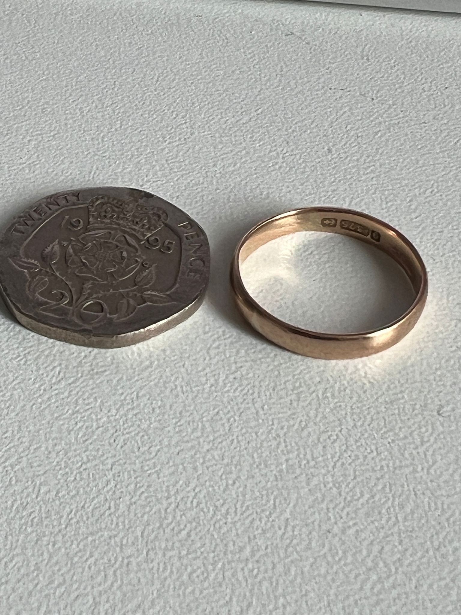 Ring next to 20p coin