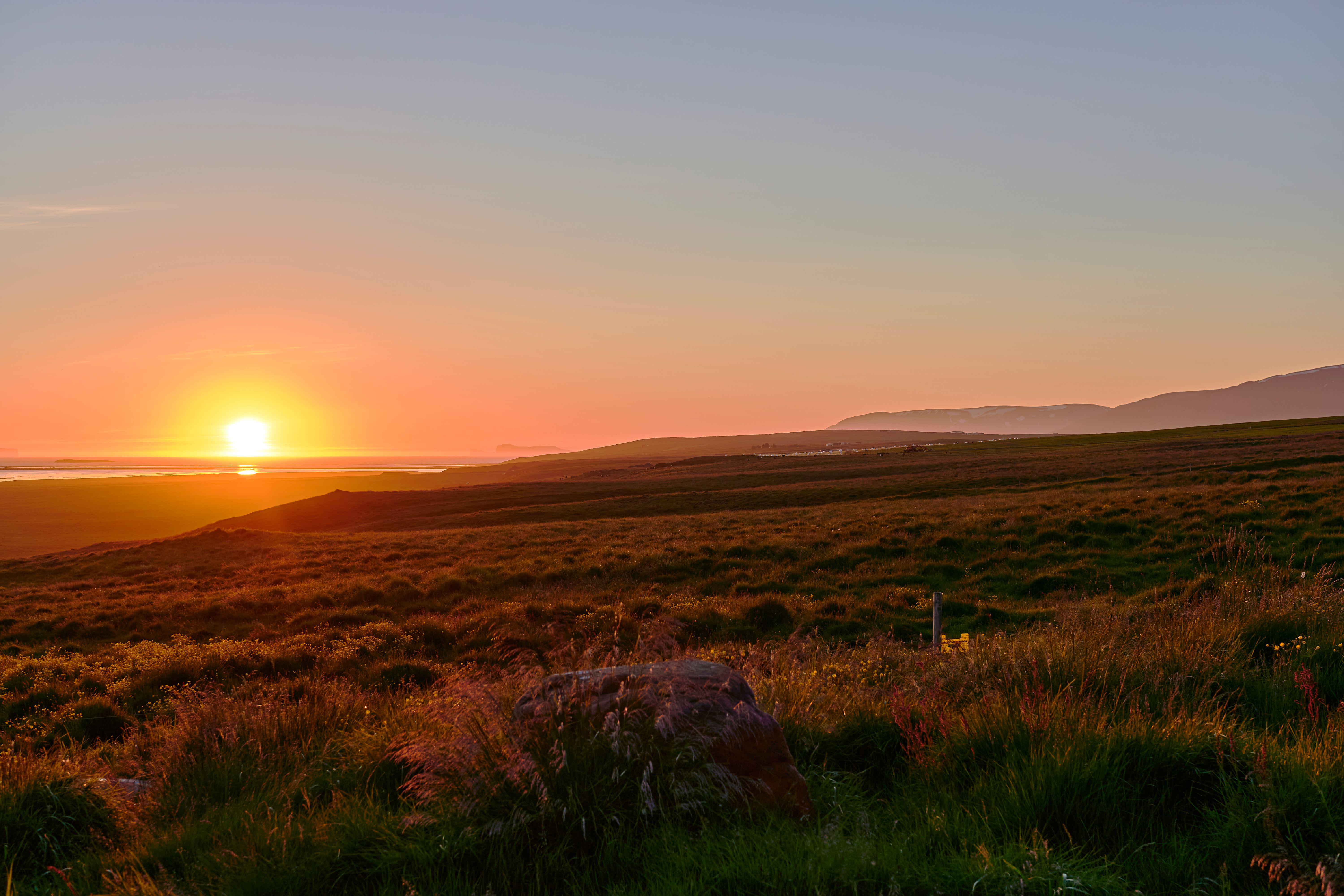 A midnight sunset in Skagafjordur, Iceland (Alamy/PA)