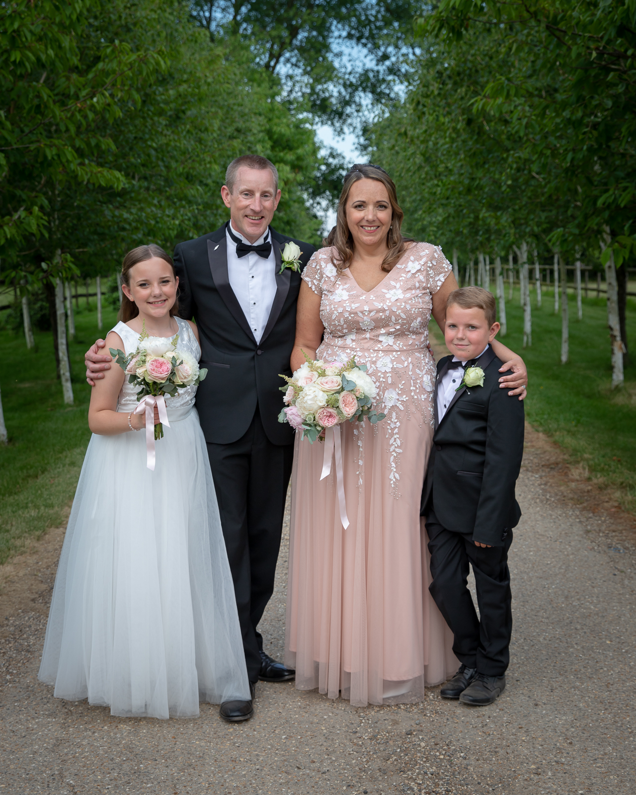 Rebecca and Jonathan Muggleton with their two children on their wedding day