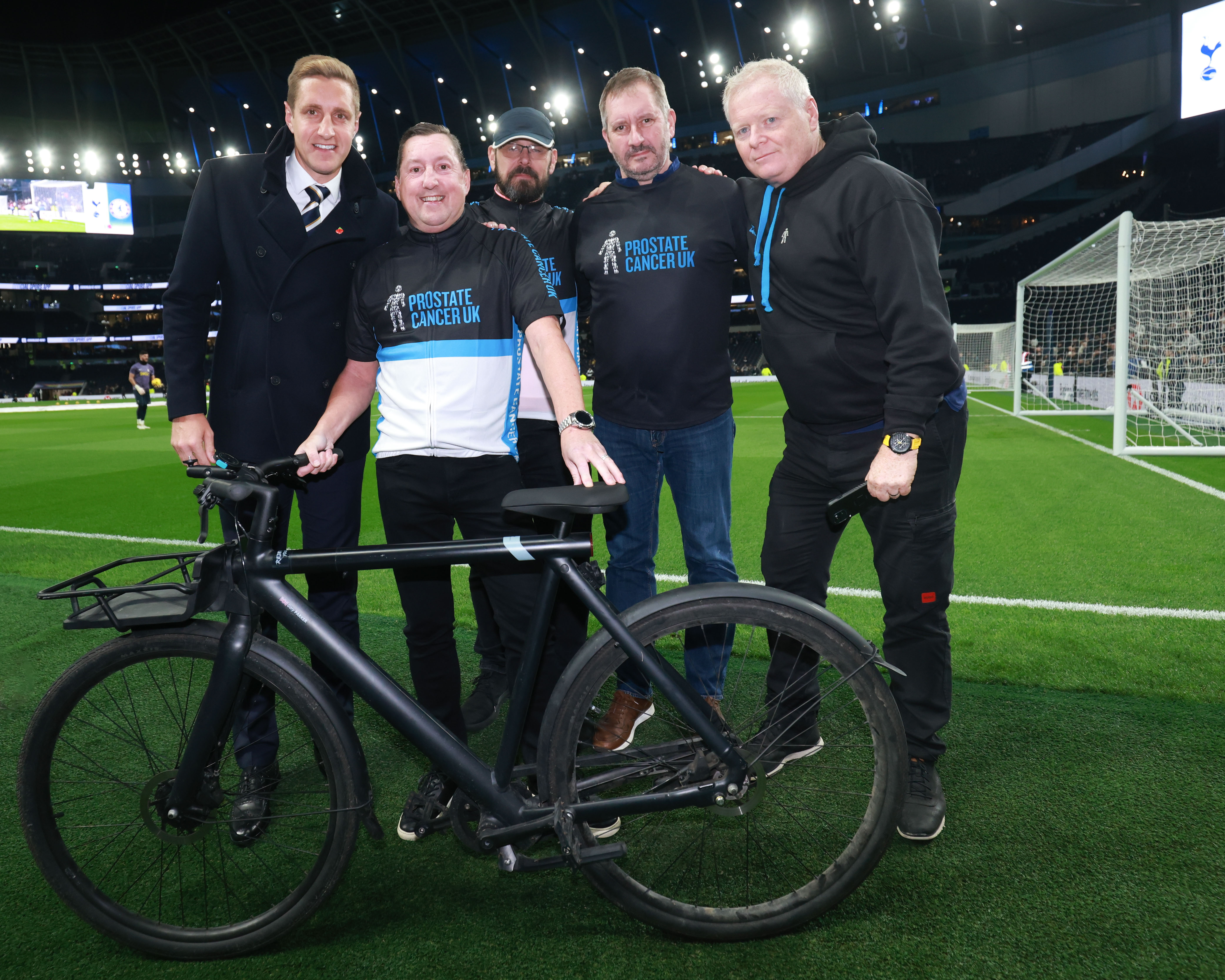 Former Tottenham player Michael Dawson (left) with Prostate Cancer UK guests