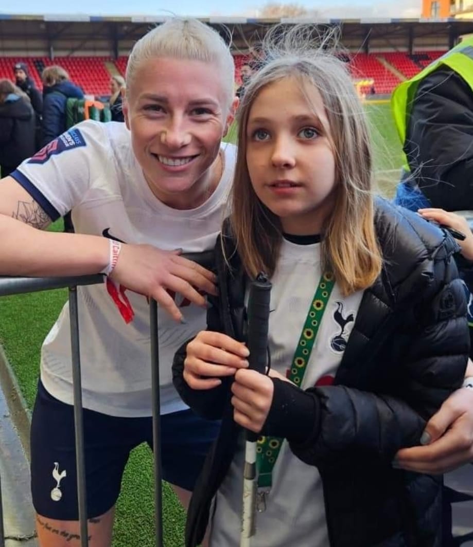 Caitlin Passey poses with footballer Beth England 