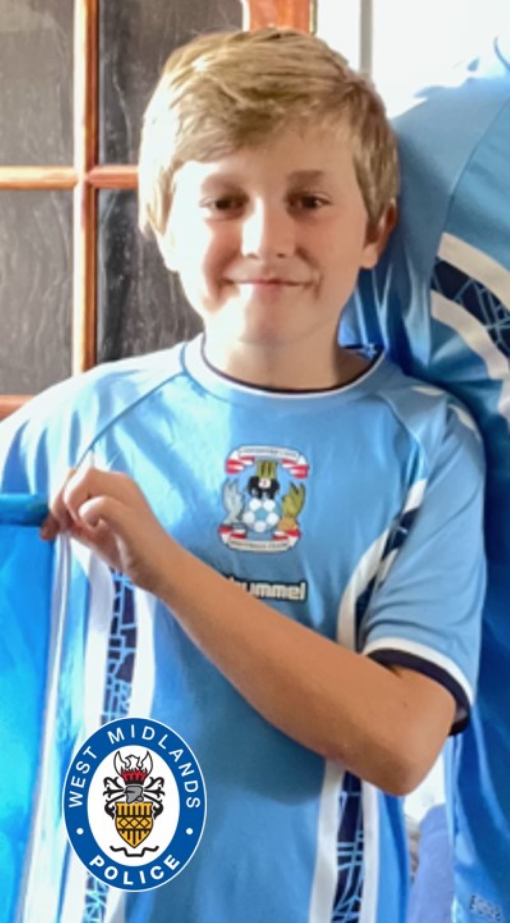 Keaton Slater smiling and wearing a Coventry City football shirt
