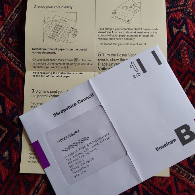 An envelope containing a postal vote 