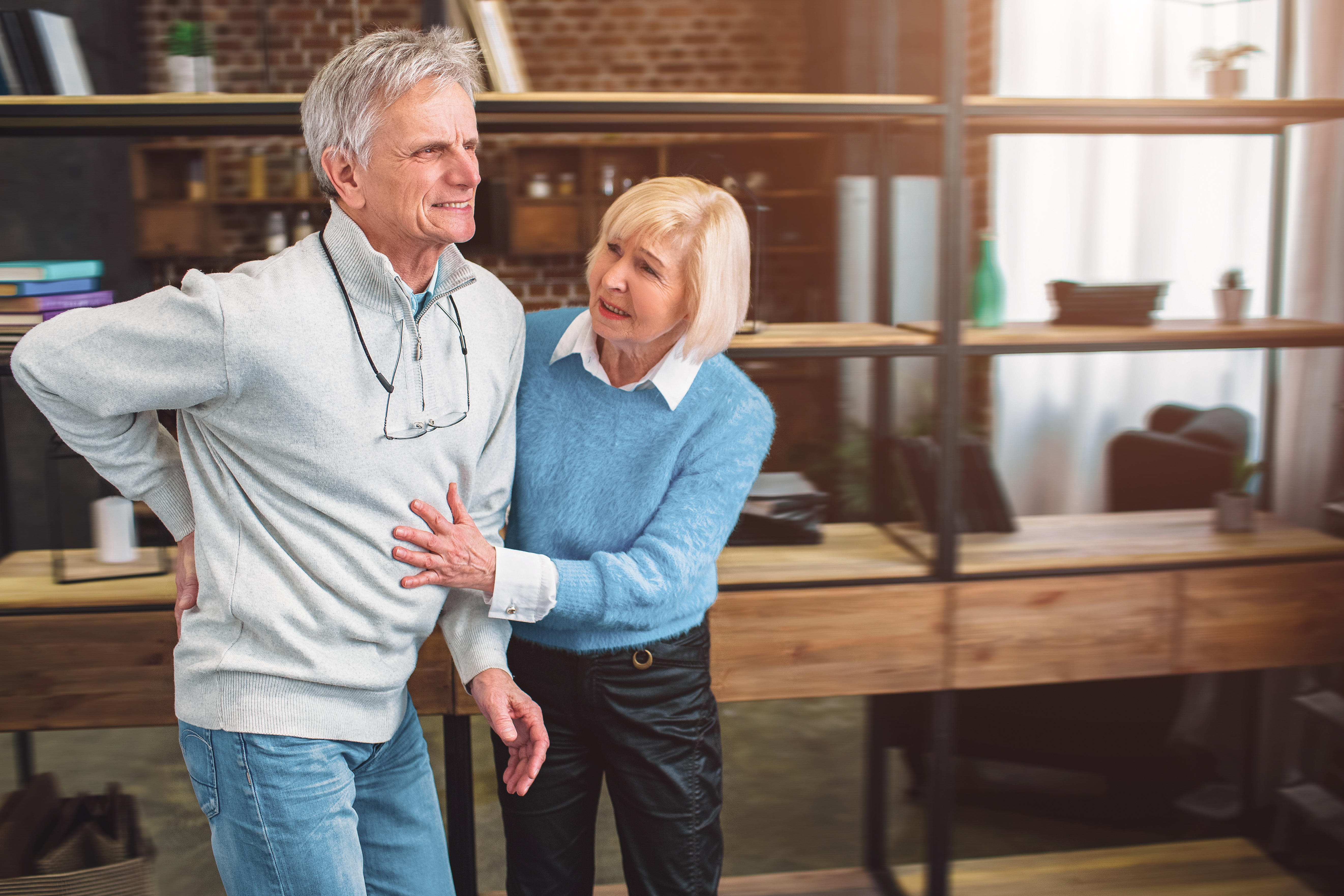 A picture of old man keeping his hand on the back