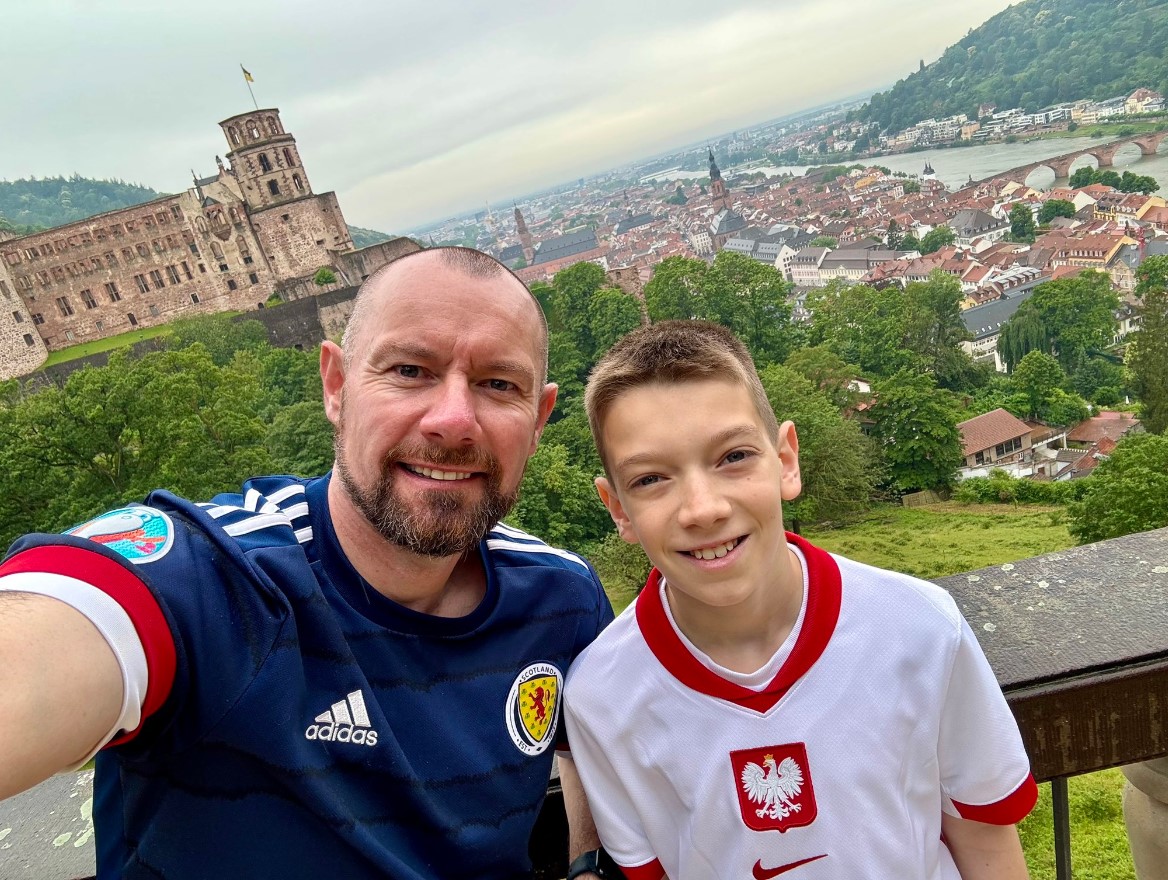 Iain and Aleks posing for a photo with a German city in the background