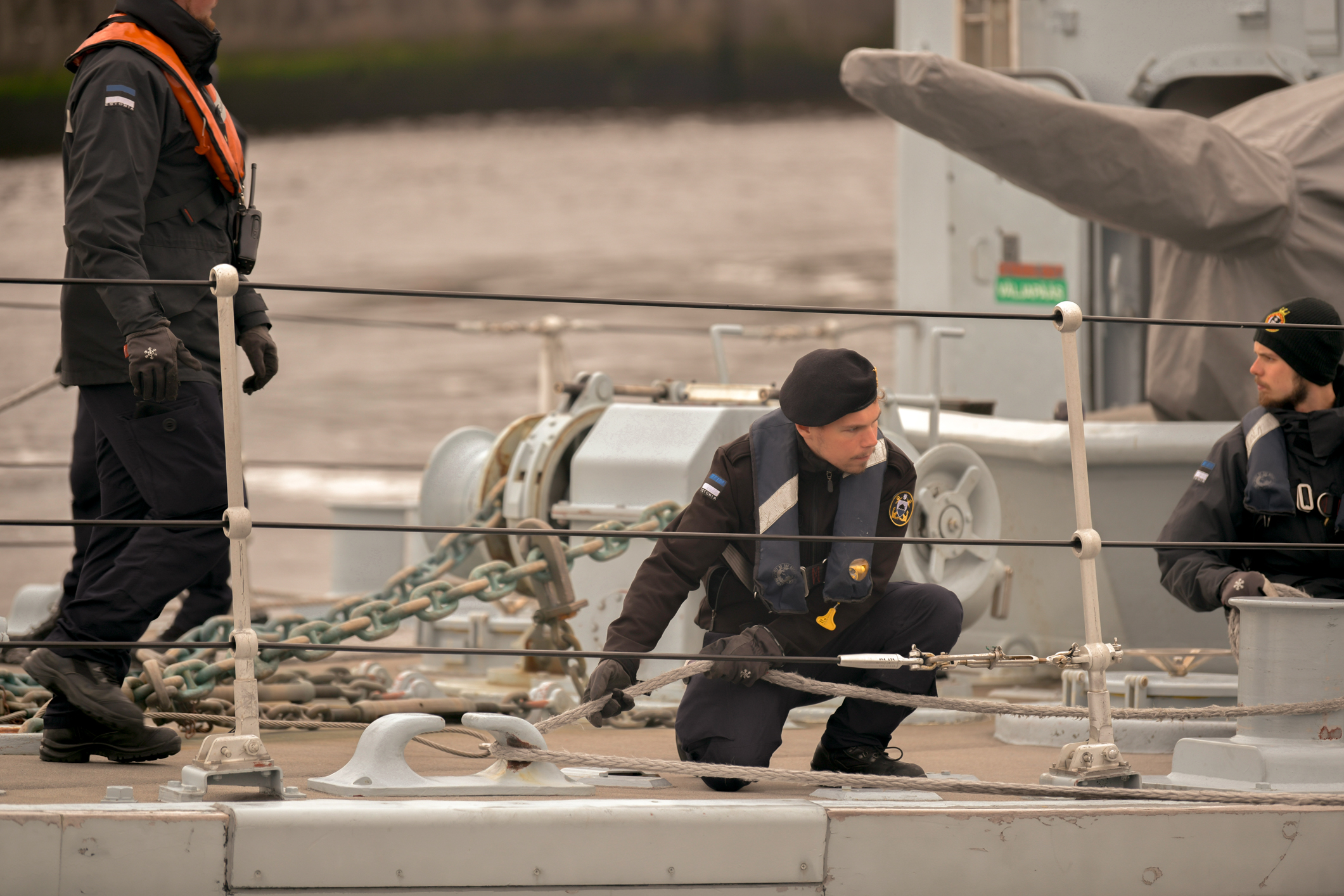 Crewmen aboard a vessel that will serve as a training hub during the operation