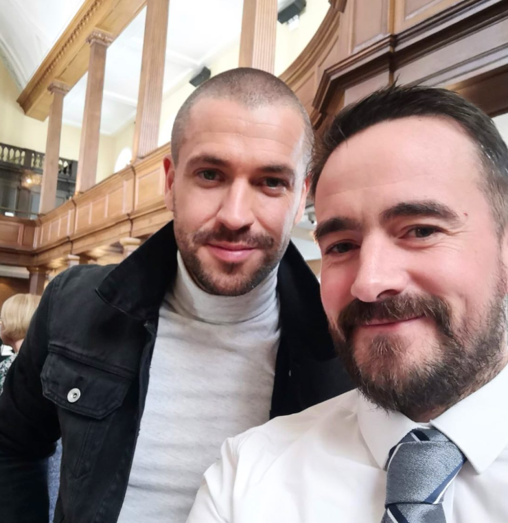 Singer Shane Ward pictured with a man in a shirt and tie