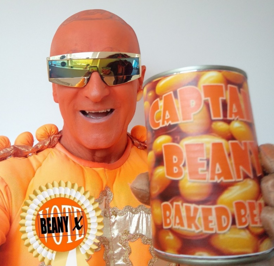 Captain Beany holding a tin of beans saying Captain Beany baked beans