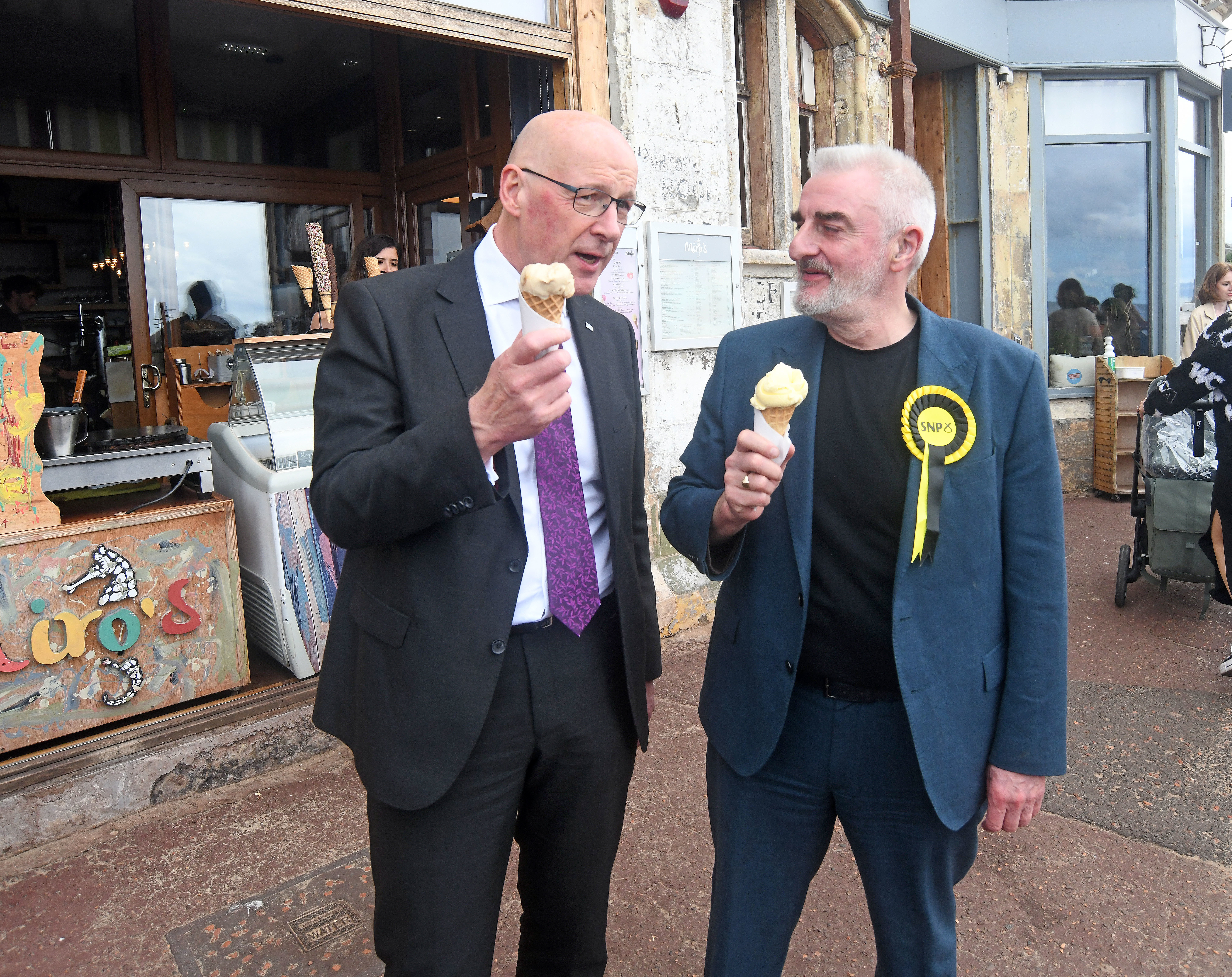 First Minister John Swinney and Edinburgh East and Musselburgh candidate Tommy Sheppard enjoy eating ice-cream cones while campaigning in Portobello