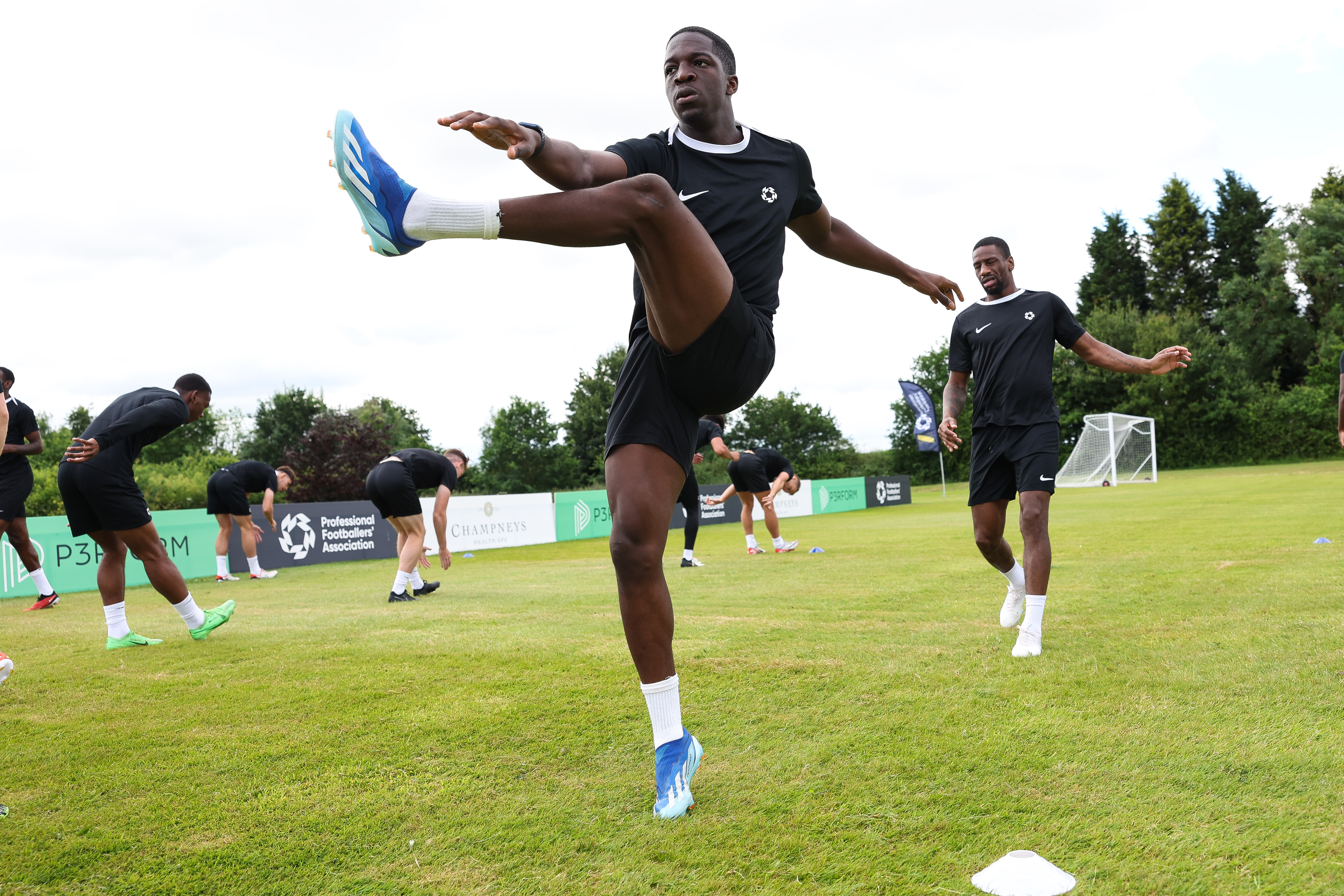 Former Cambridge player Saleem Akanbi warms up at a PFA out-of-contract pre-season camp in Leicestershire 