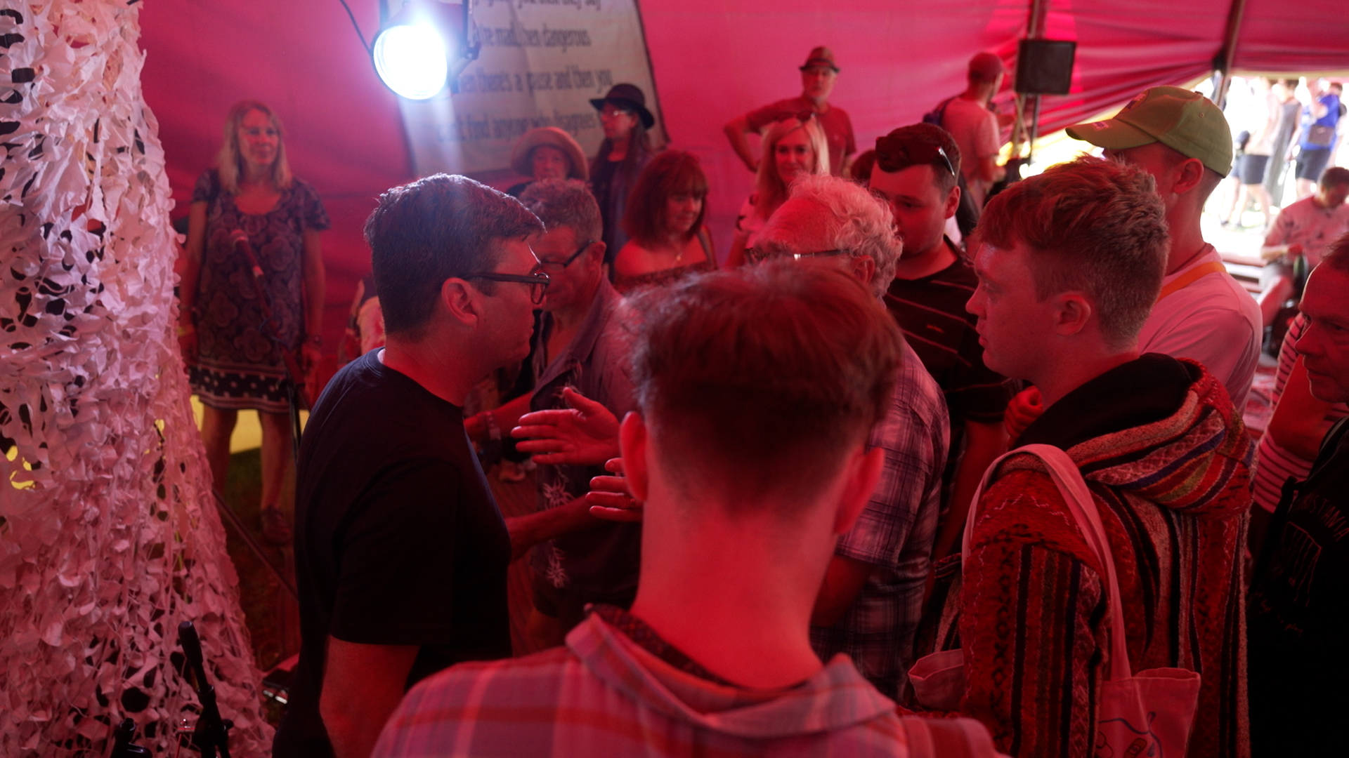 Audience members speaking to Manchester Mayor Andy Burnham at Glastonbury Festival