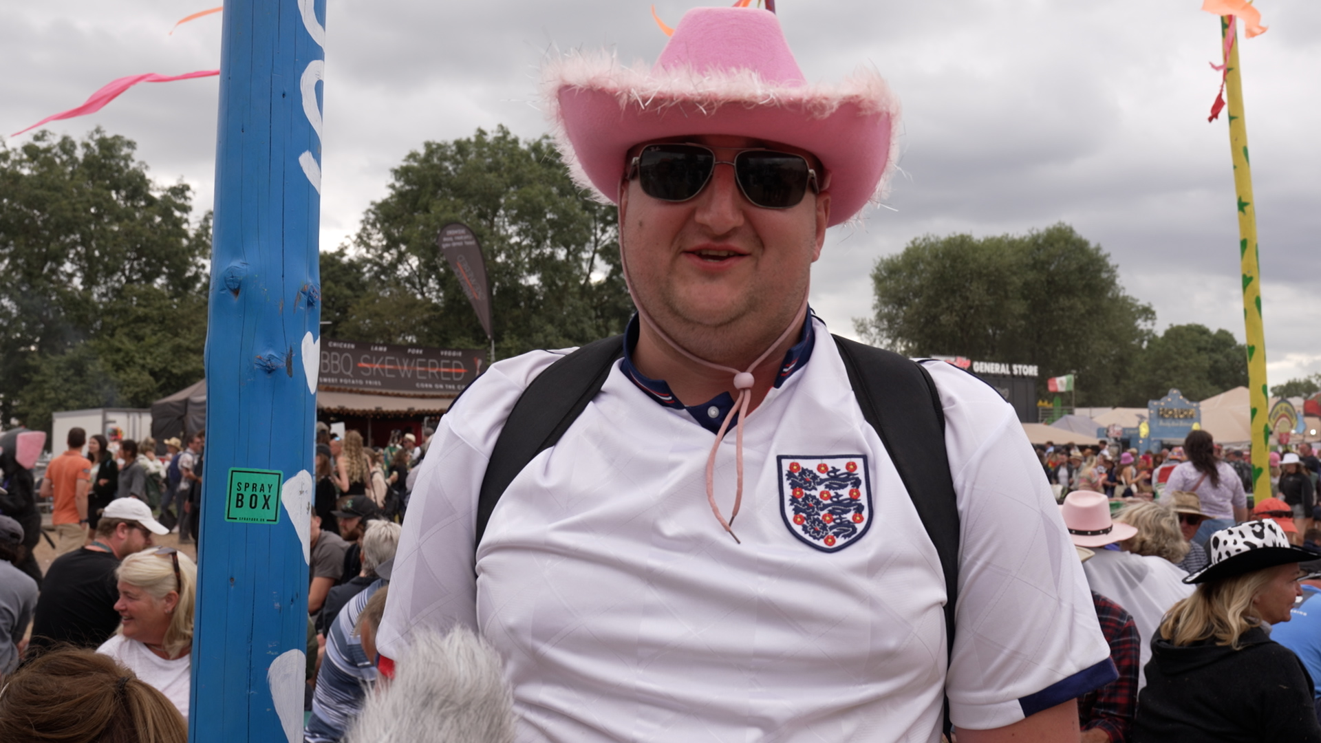 Richard Perrott wearing a white England football shirt and a pink cowboy hat