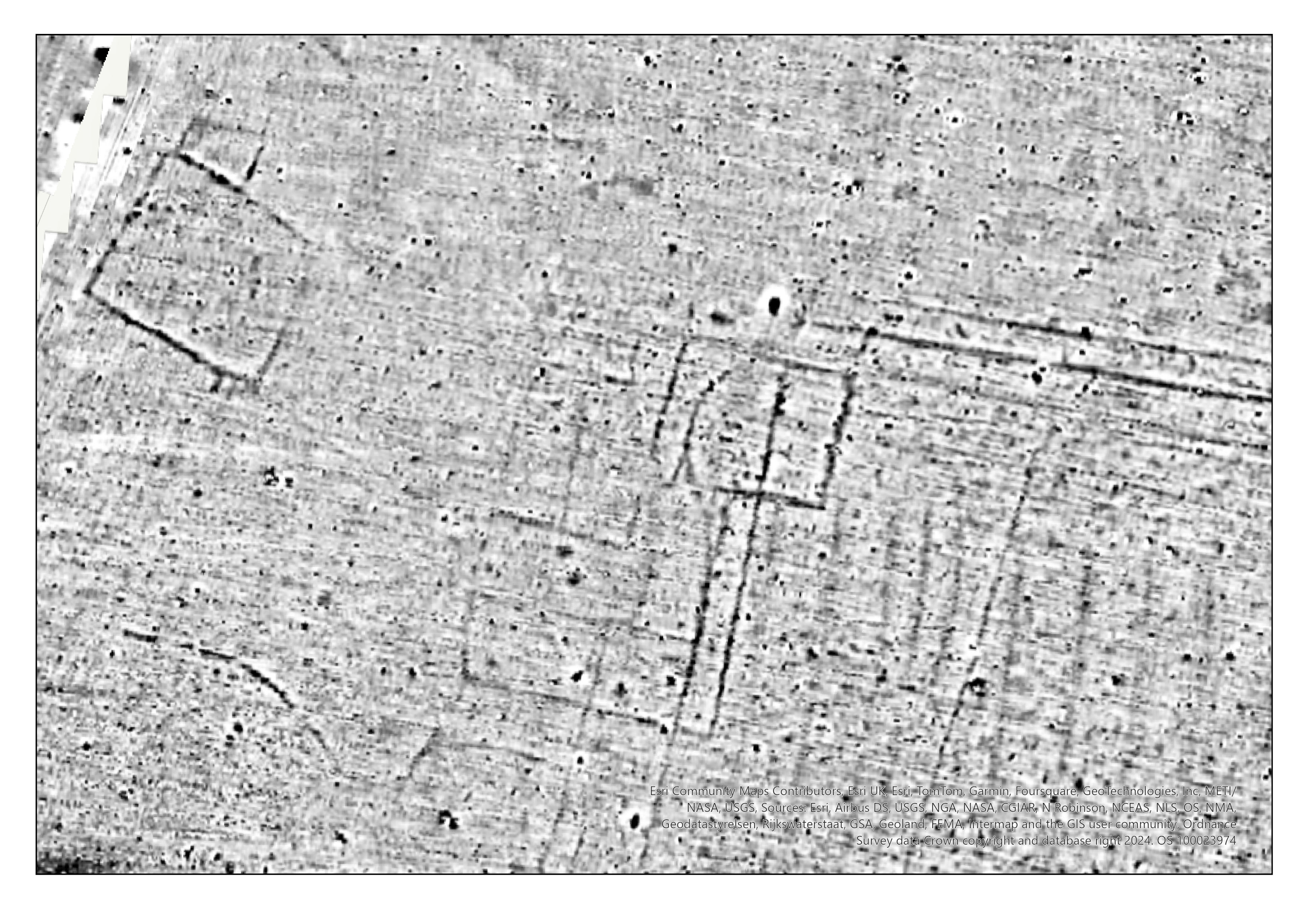Image of grey scale geophysics data with darker lines and areas showing the site of possible Roman villa