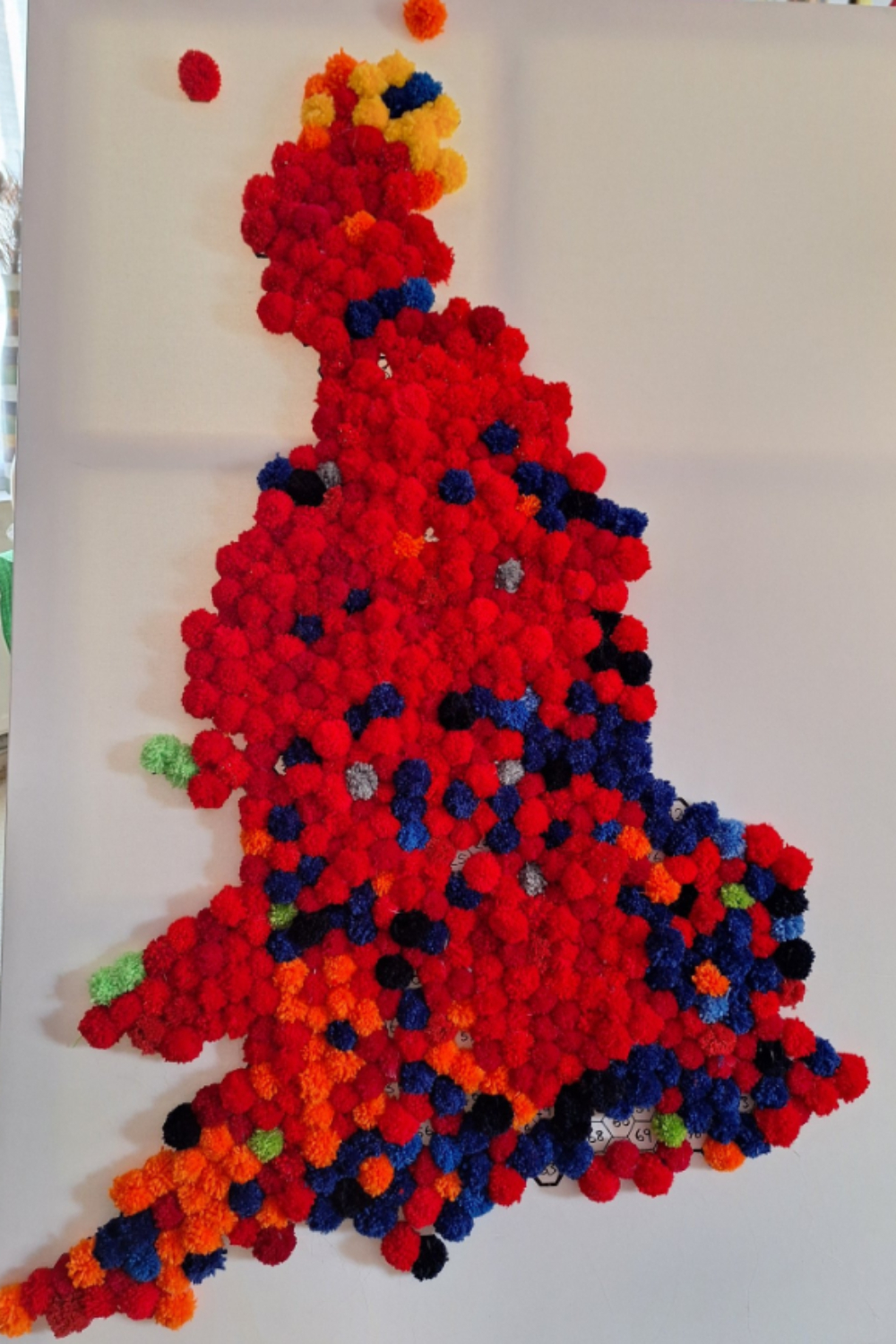 An election map covered in pom poms