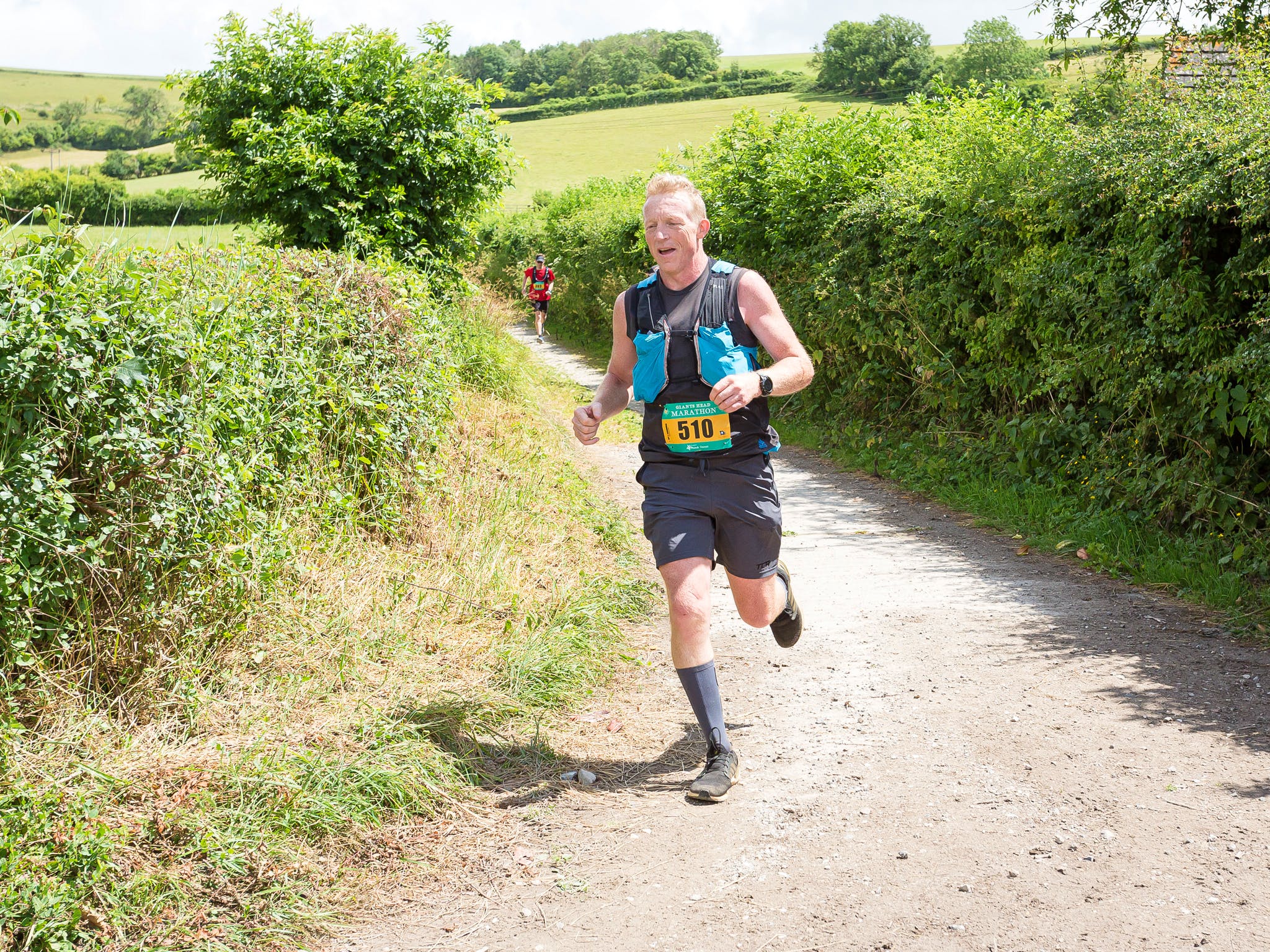 Frank Wainwright runs on a road