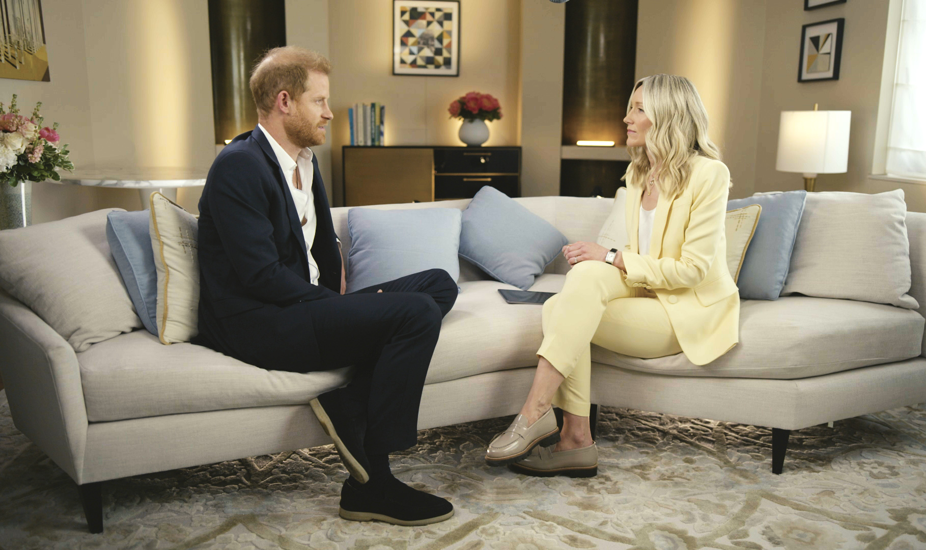 Harry sat on a sofa facing ITV News' Rebecca Barry during the interview