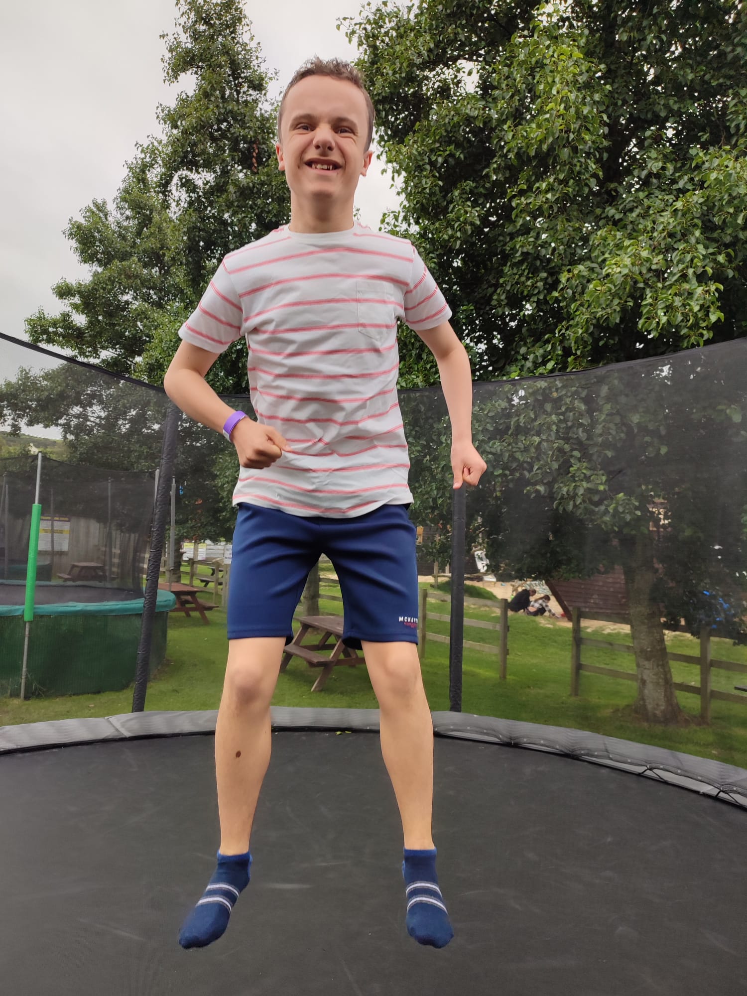 Boy jumping on trampoline