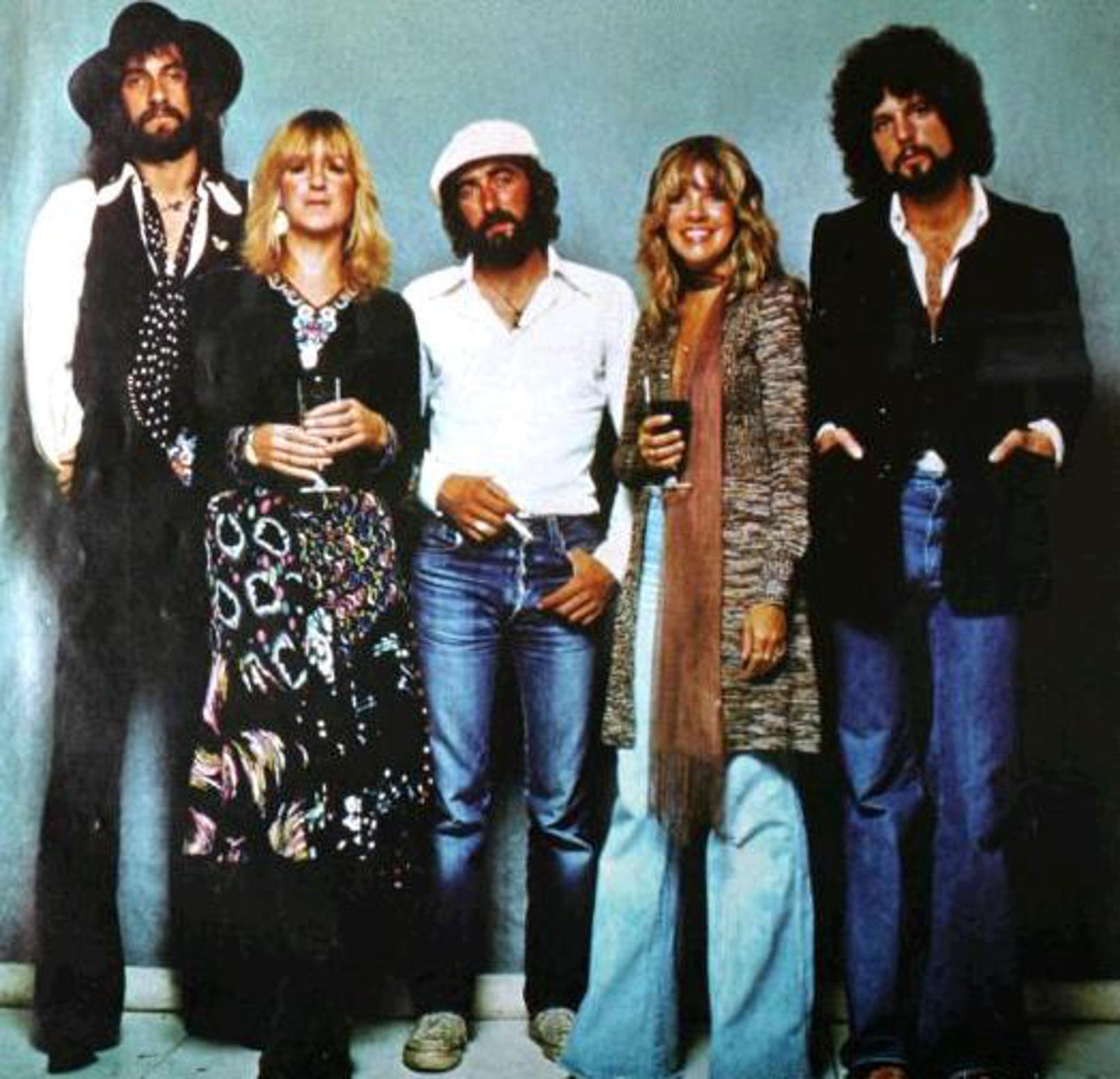 The band Fleetwood Mac pose for a photos dressed in Seventies styels from flared jeans to suede waistcoats 