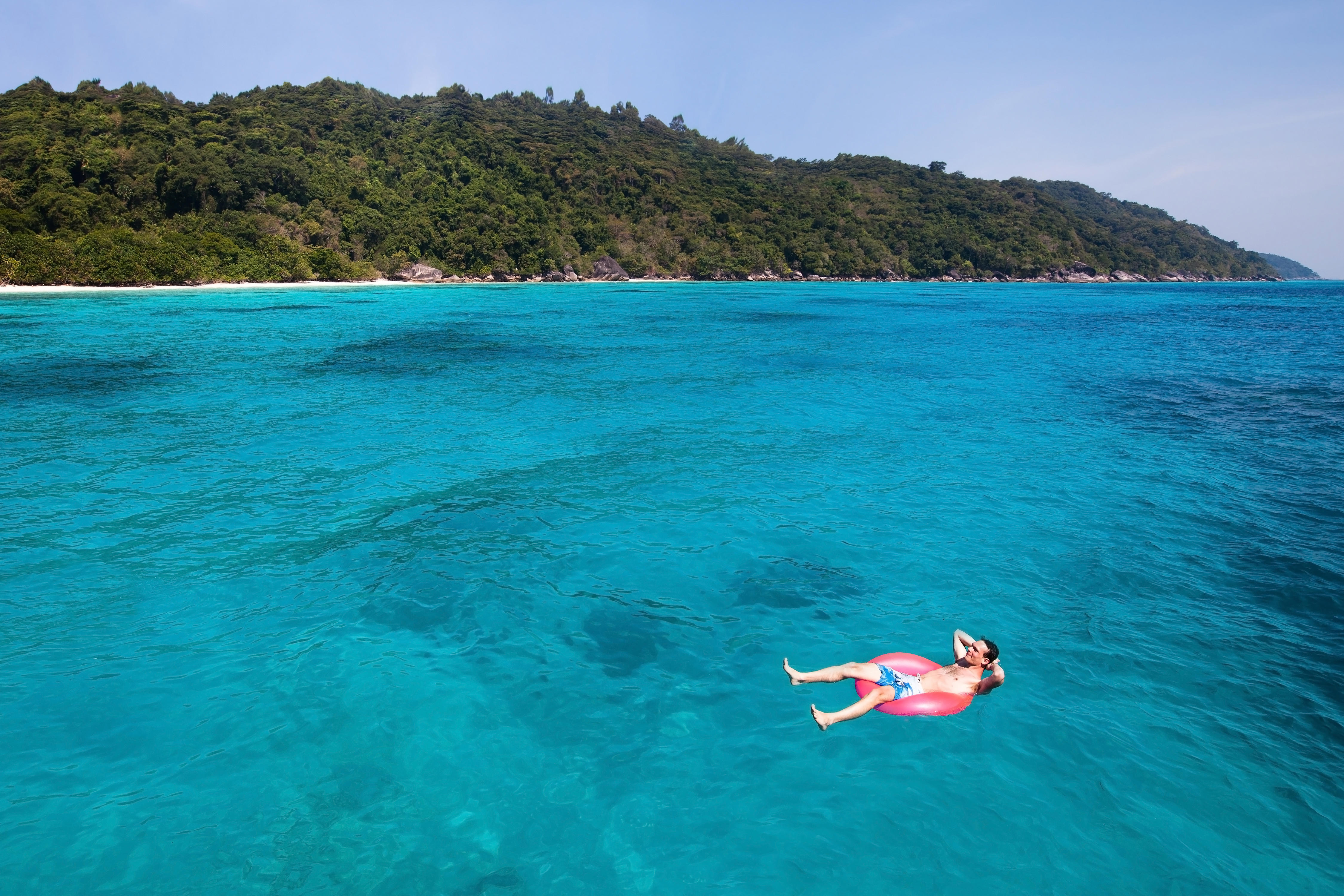 Man floating in a rubber ring in the Mediterranean Sea 