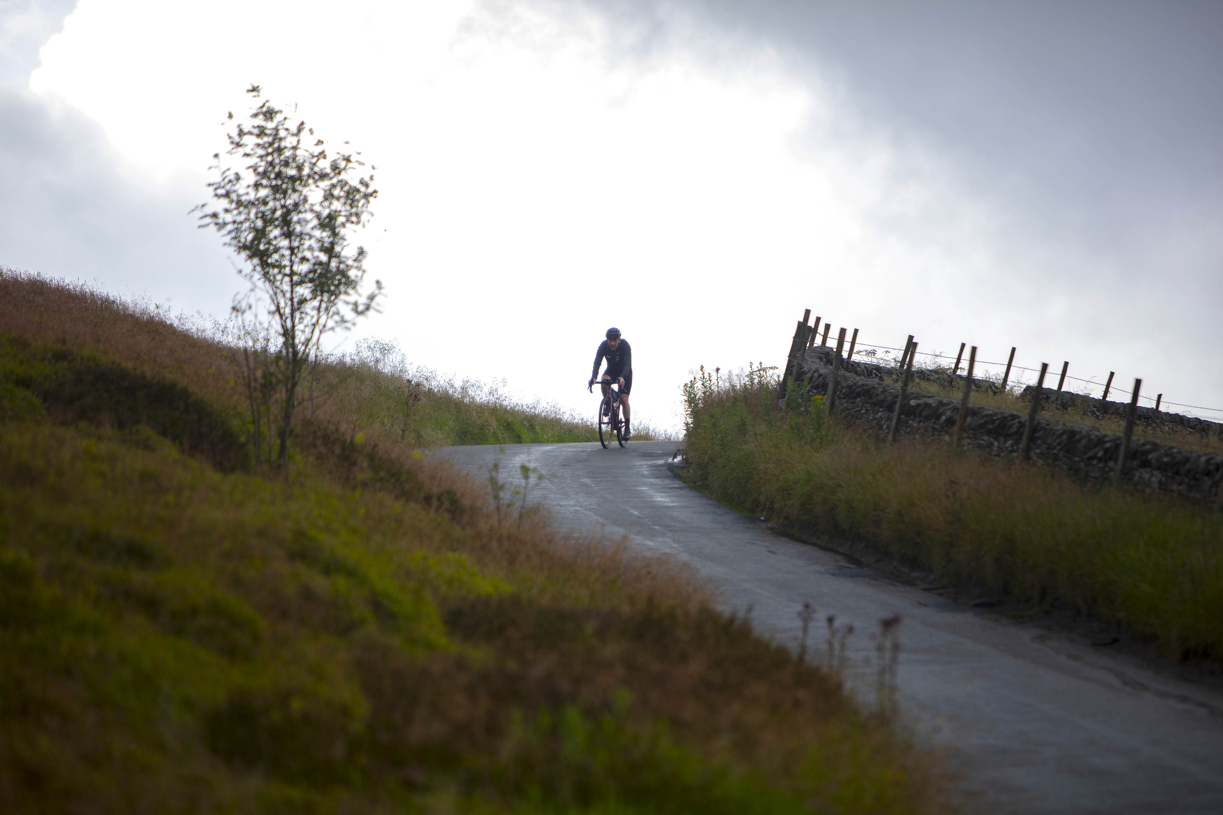 Man cycling down road 