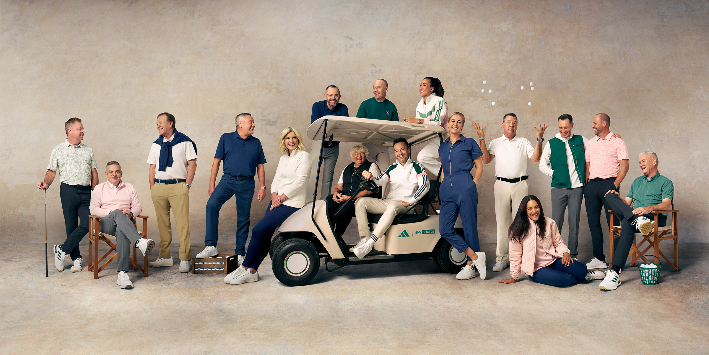 Sky Sports golf presenters pose around a golf buggy