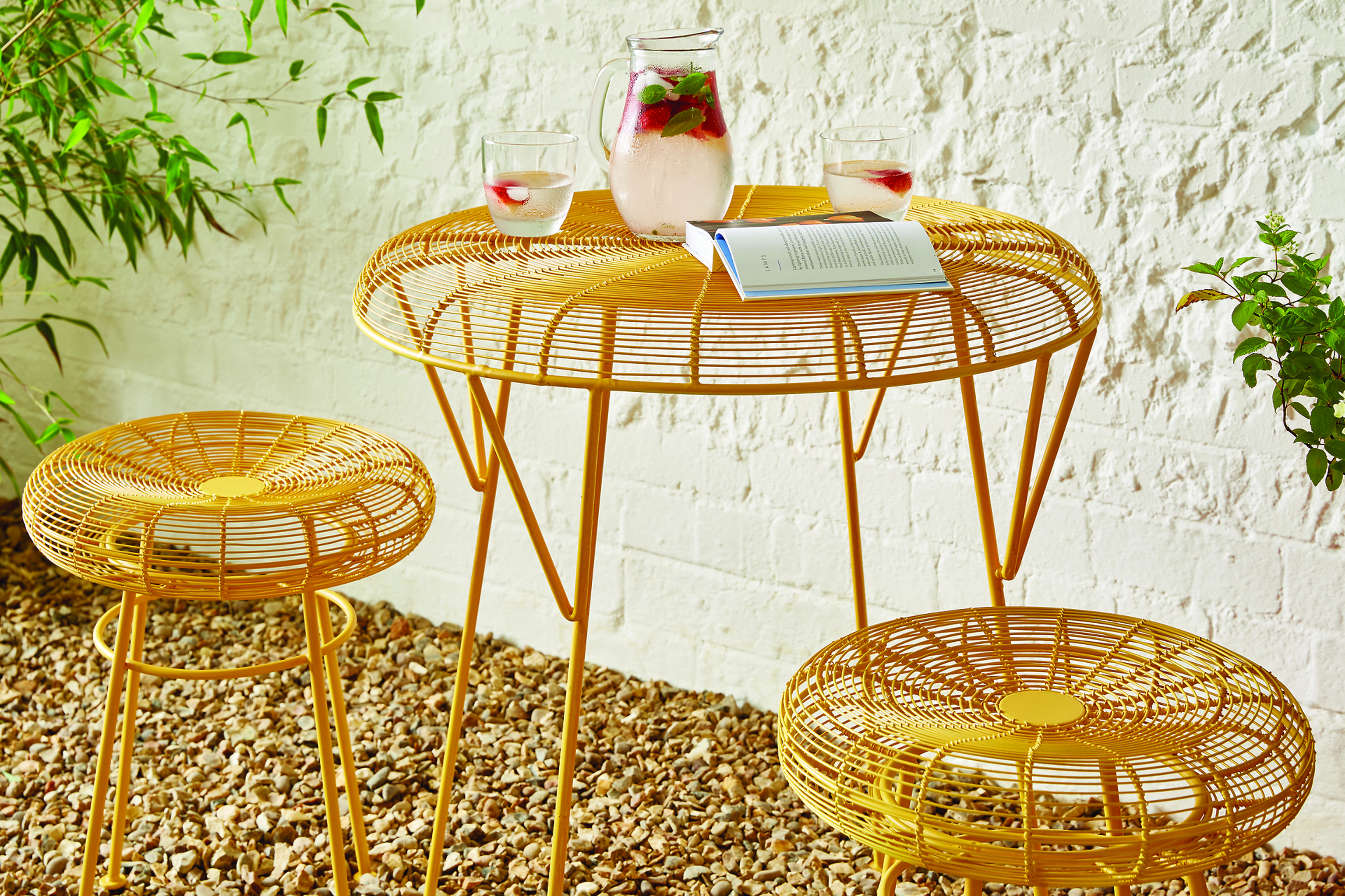 Metal table and chairs in sunshine yellow