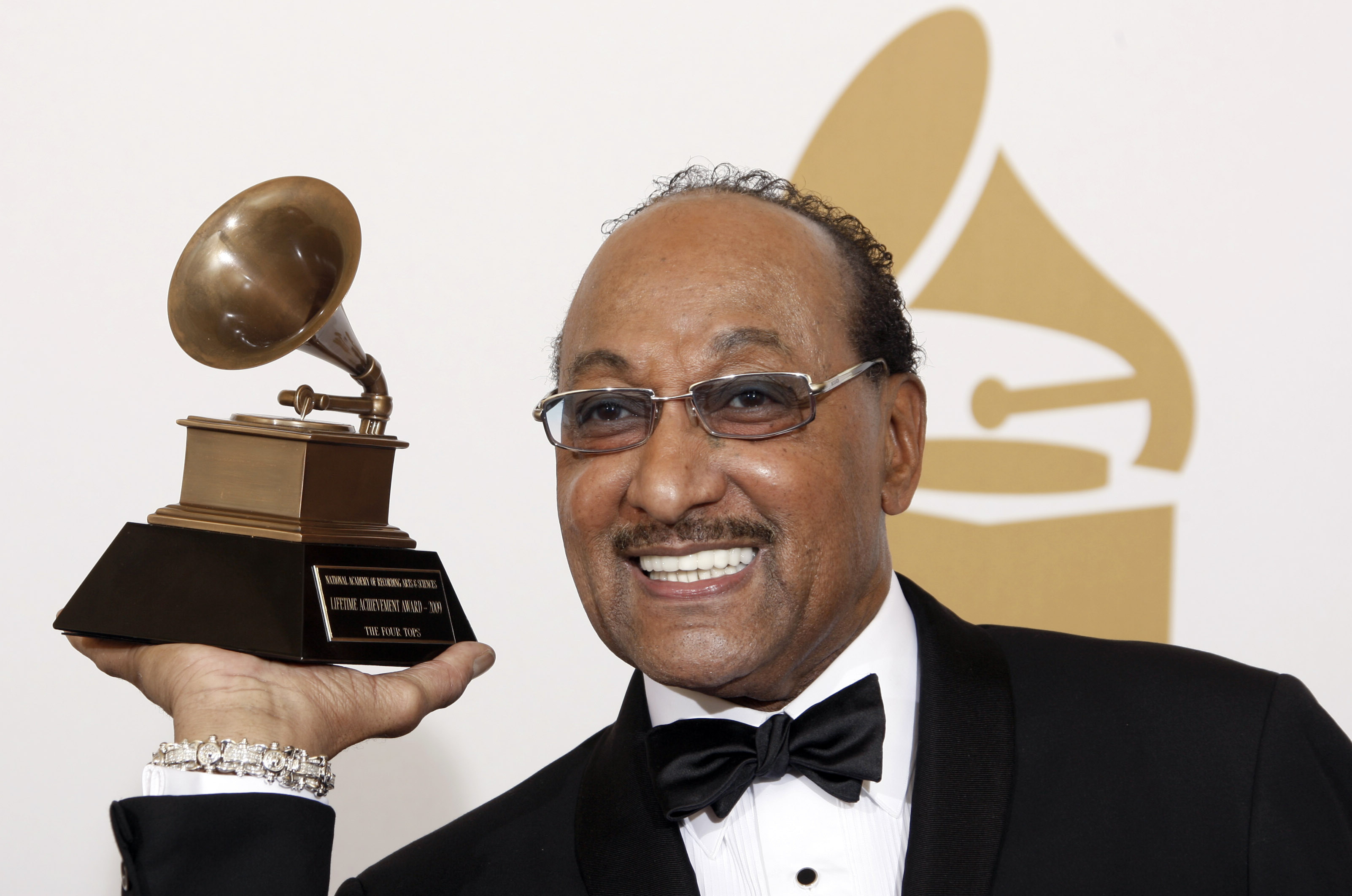 Duke Fakir holds his life time achievement award backstage at the 51st Annual Grammy Awards (Matt Sayles/AP)