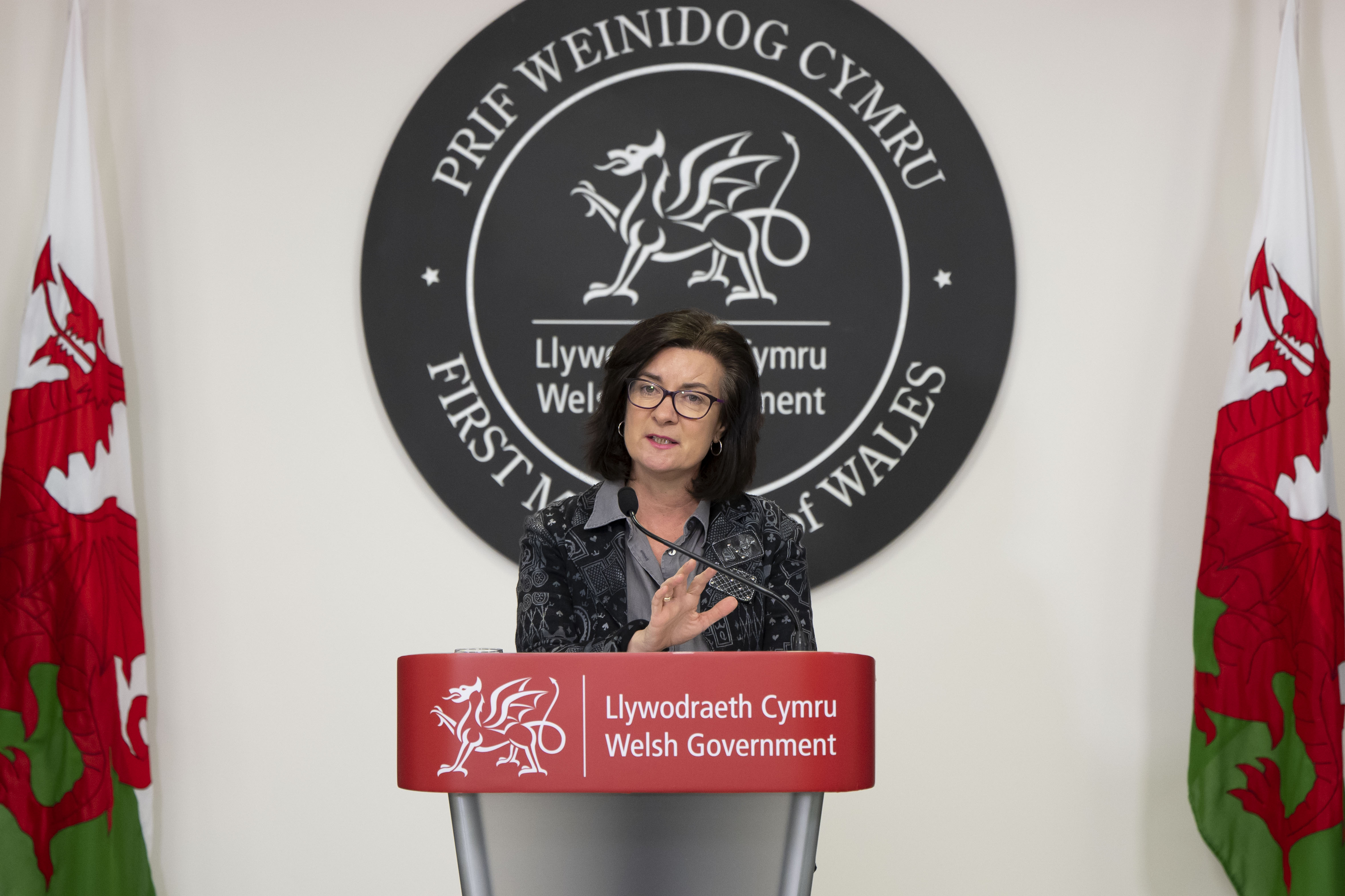 Eluned Morgan speaking at a press conference