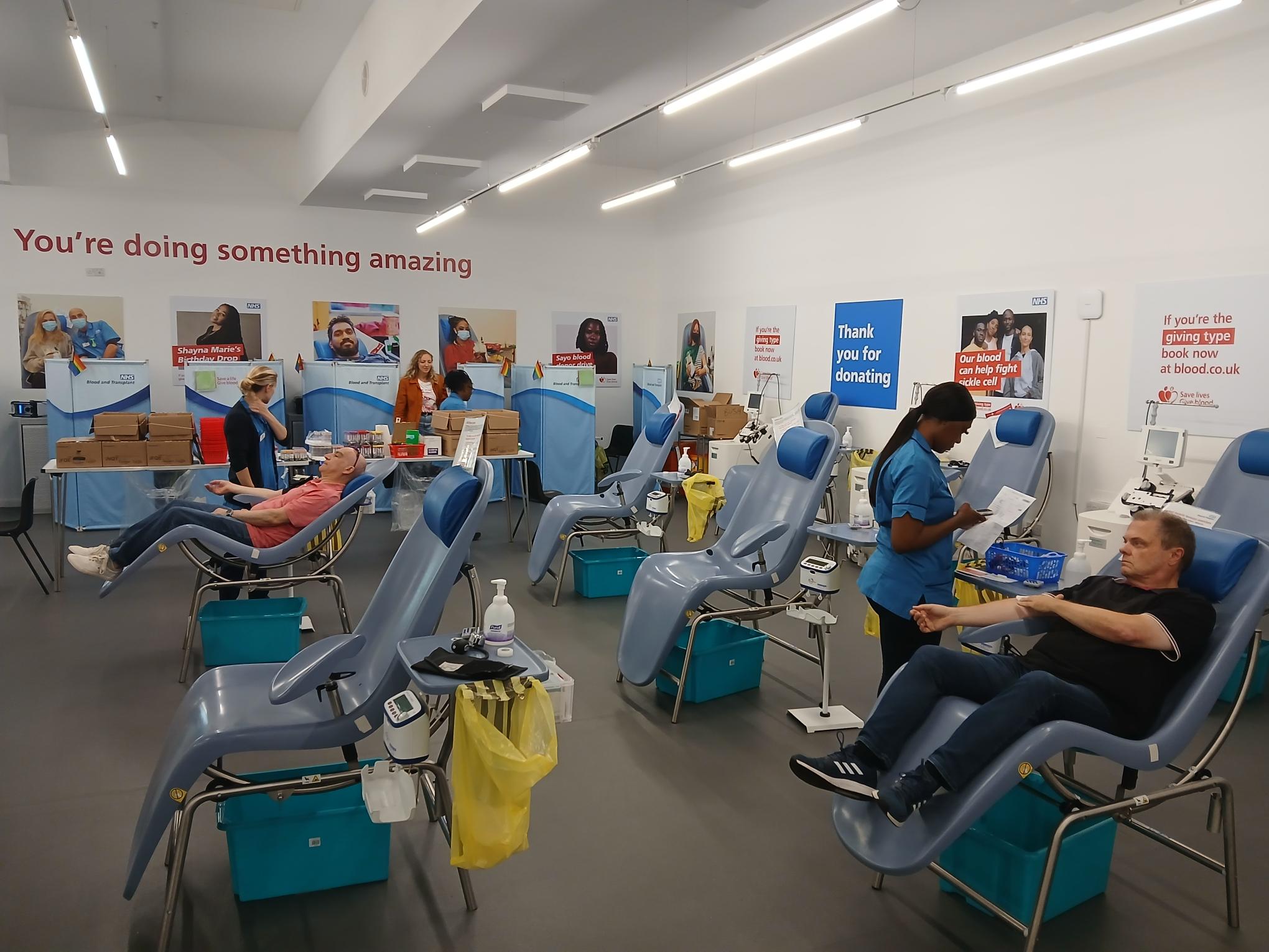 Donors in chairs and staff in an NHS Blood and Transplant Blood donor centre