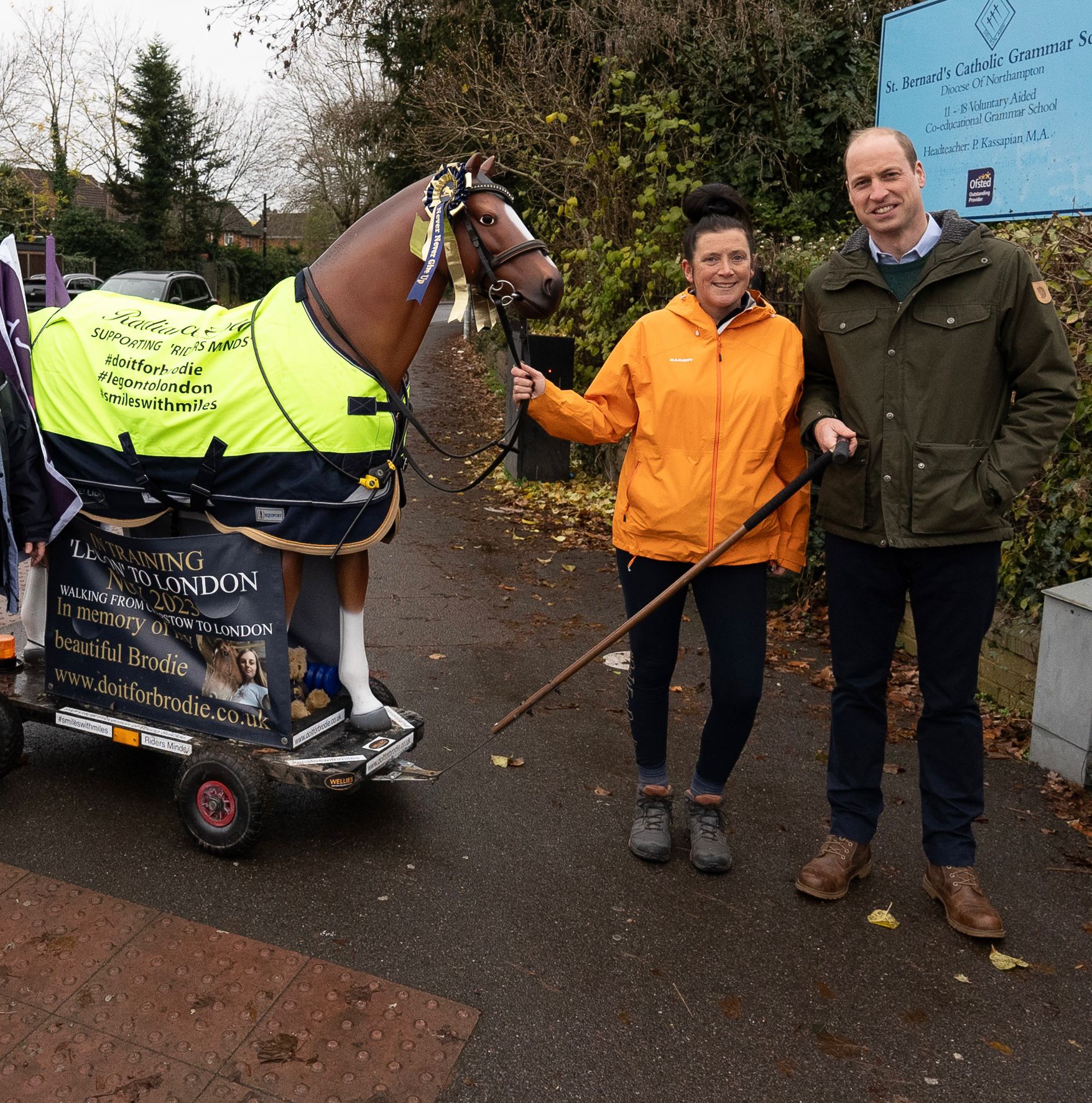 Standing woman with the Prince of Wales and a resin horse