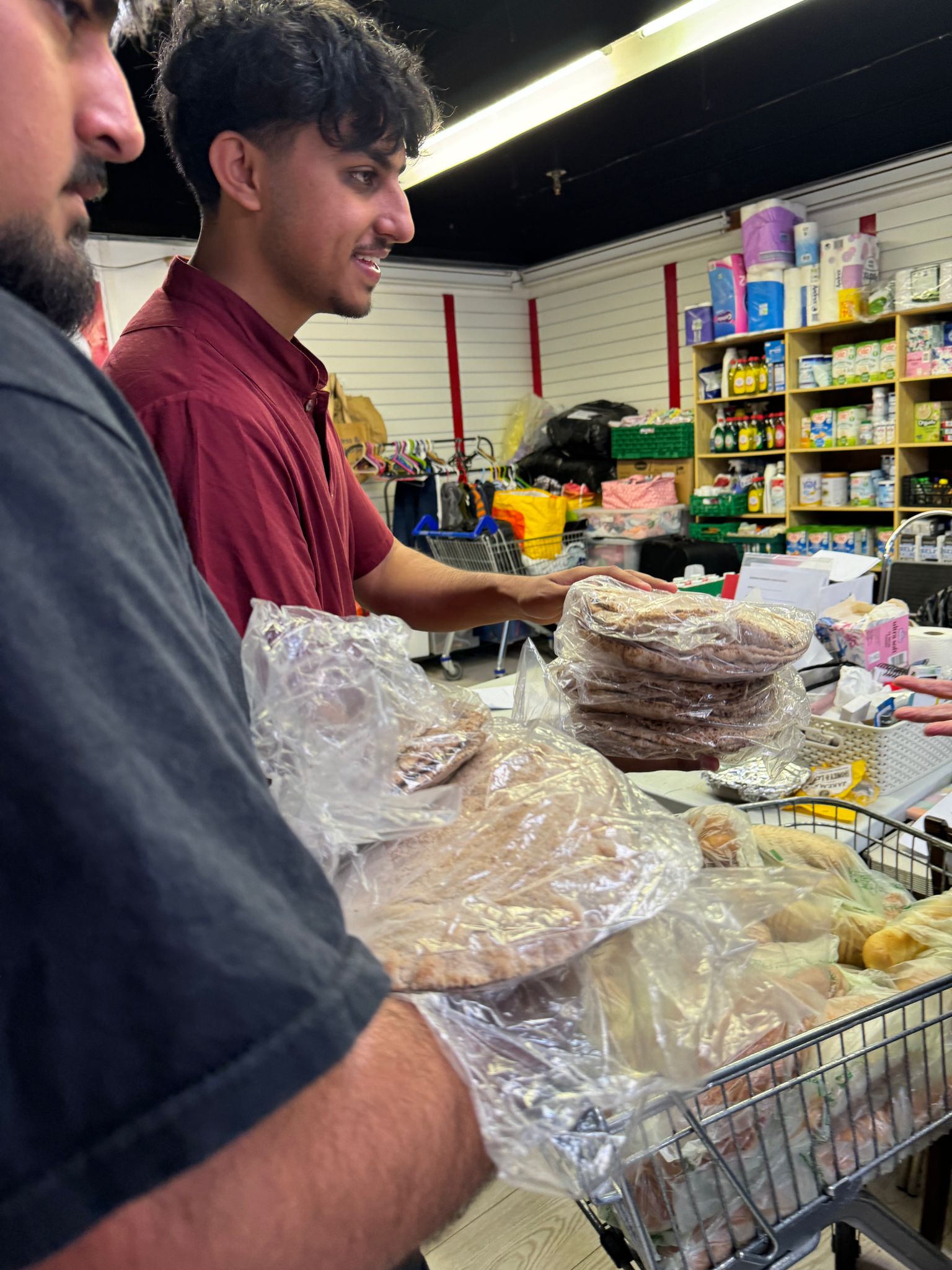 Omar Ahmad and Zaki Ahmedi delivering roti breads to a food bank in Bordon, East Hampshire