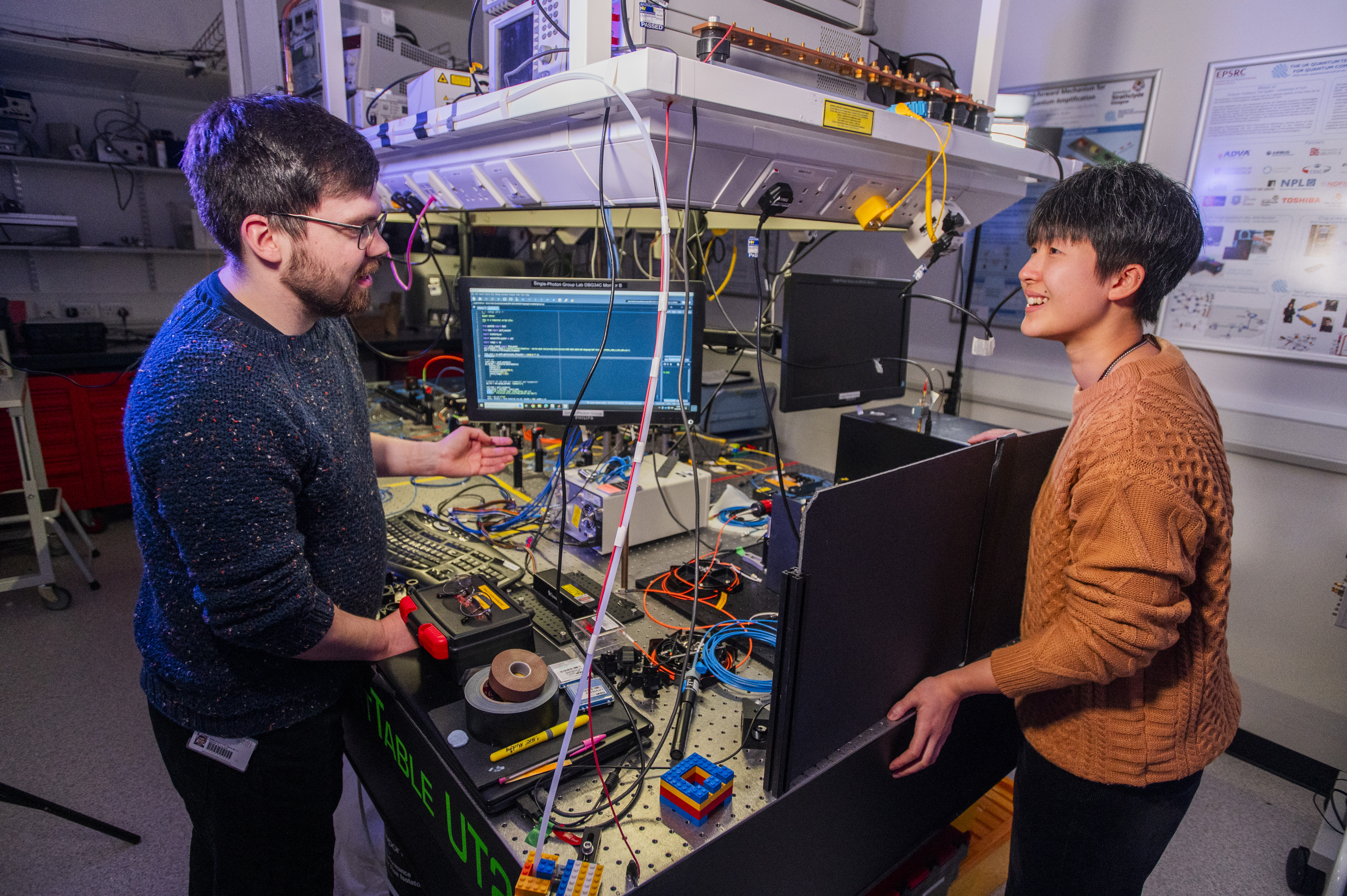 Heriot-Watt PhD students Arran Sykes and Harmony Li discuss a quantum sensing system. Credit: Heriot-Watt University