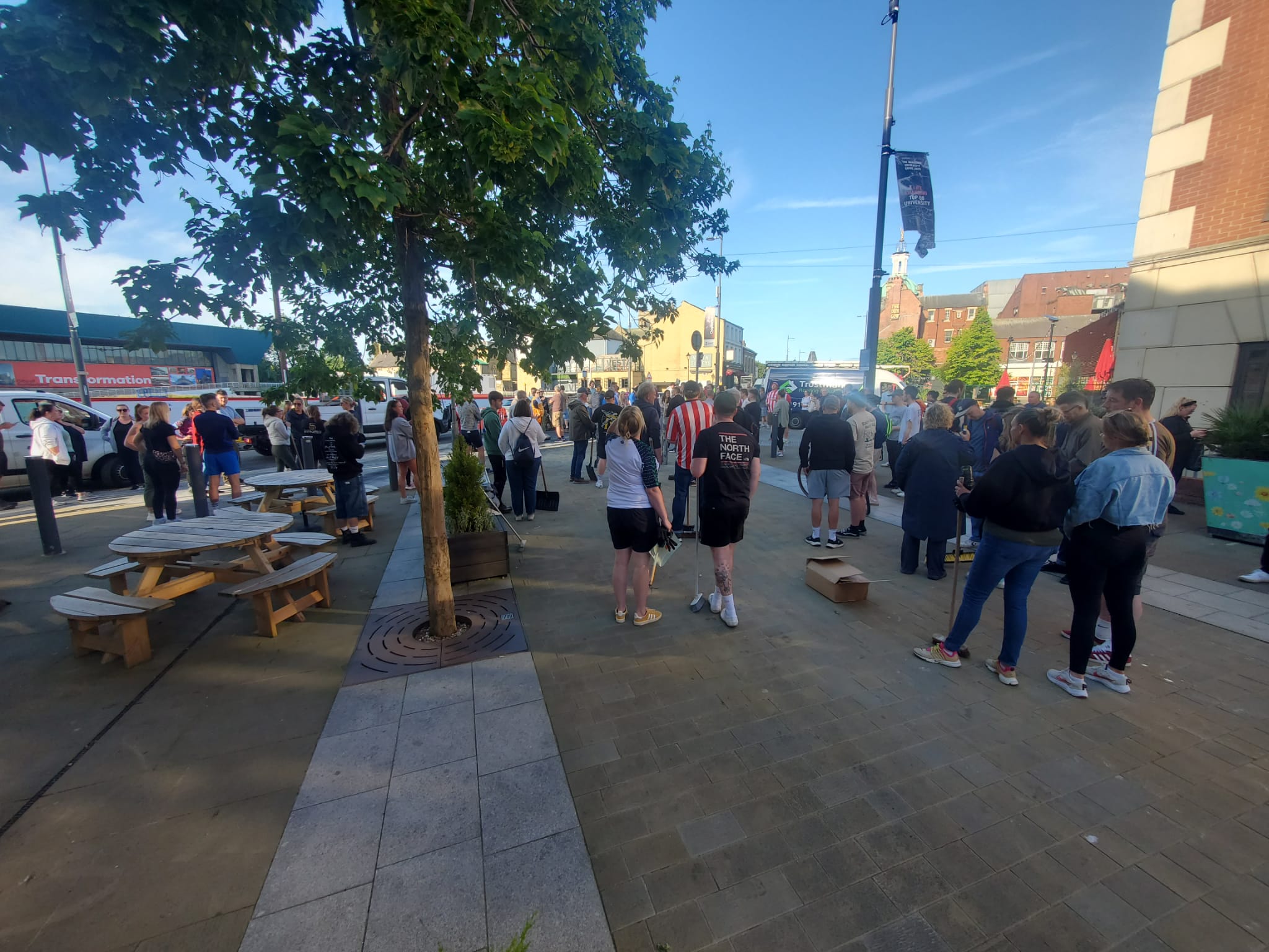 Crowds gather in a city centre square