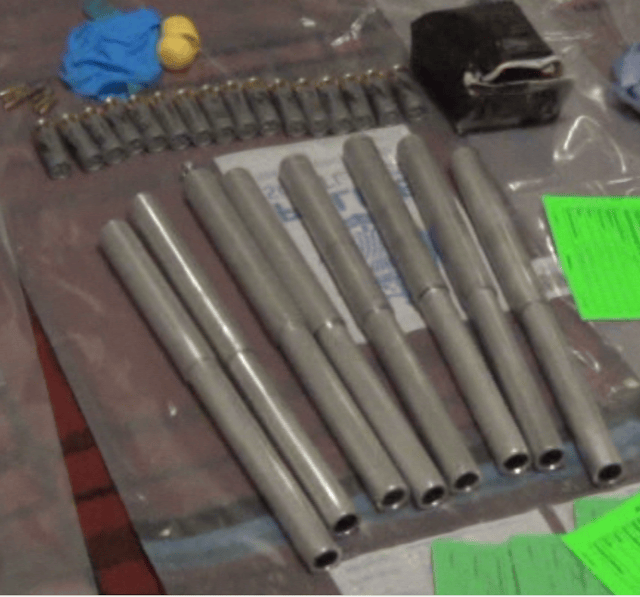 A row of small metal pipes in evidence bags