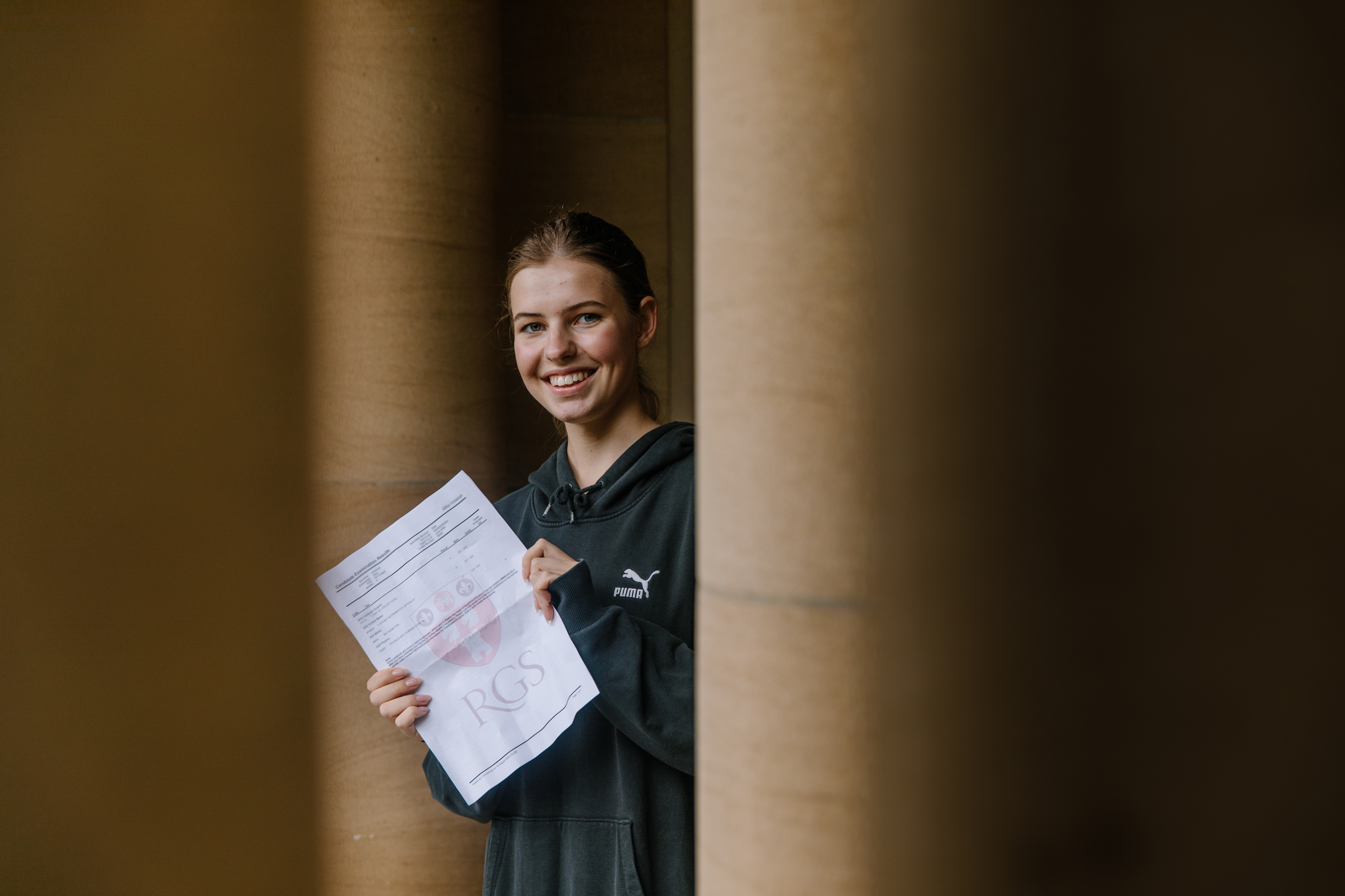 Girl with paper in her hands